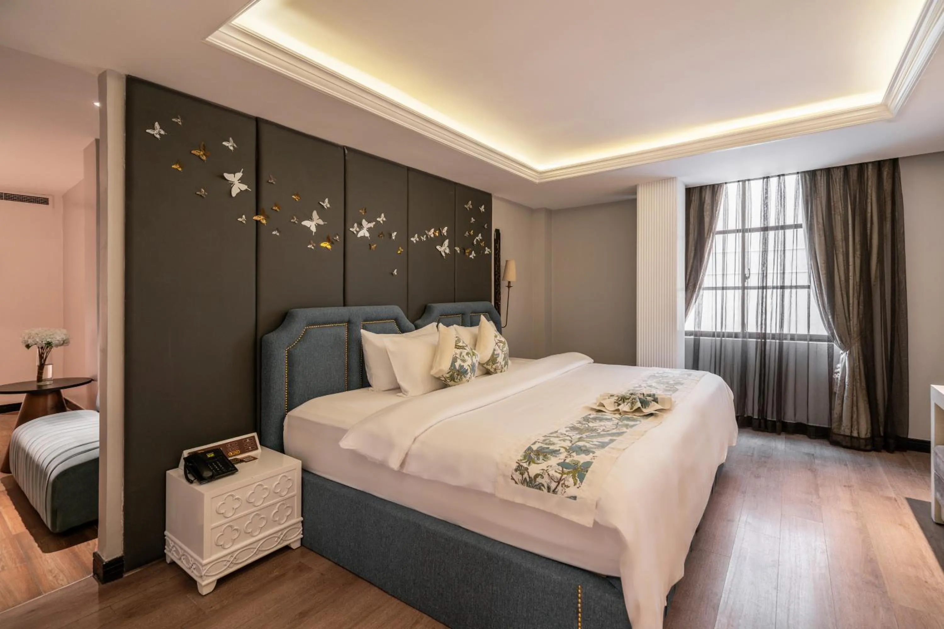 Bed in A&EM Saigon Hotel