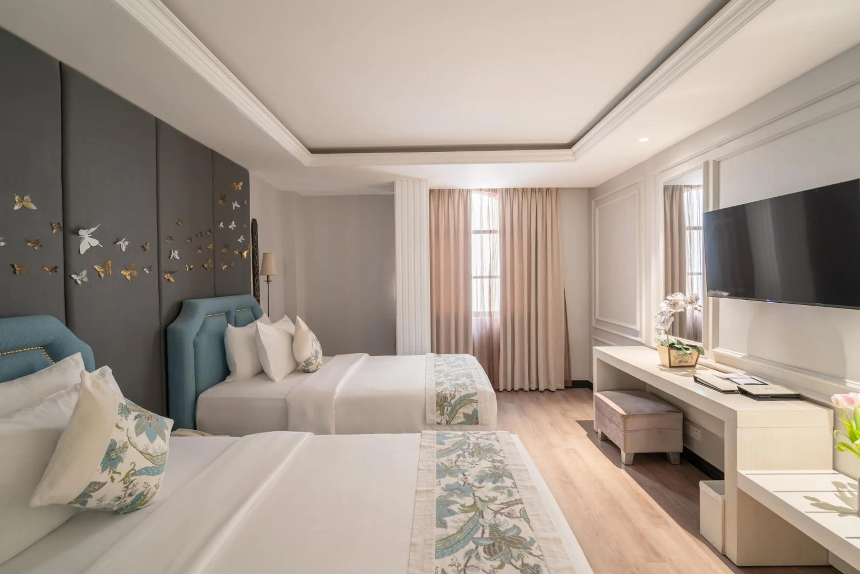 Bed in A&EM Saigon Hotel