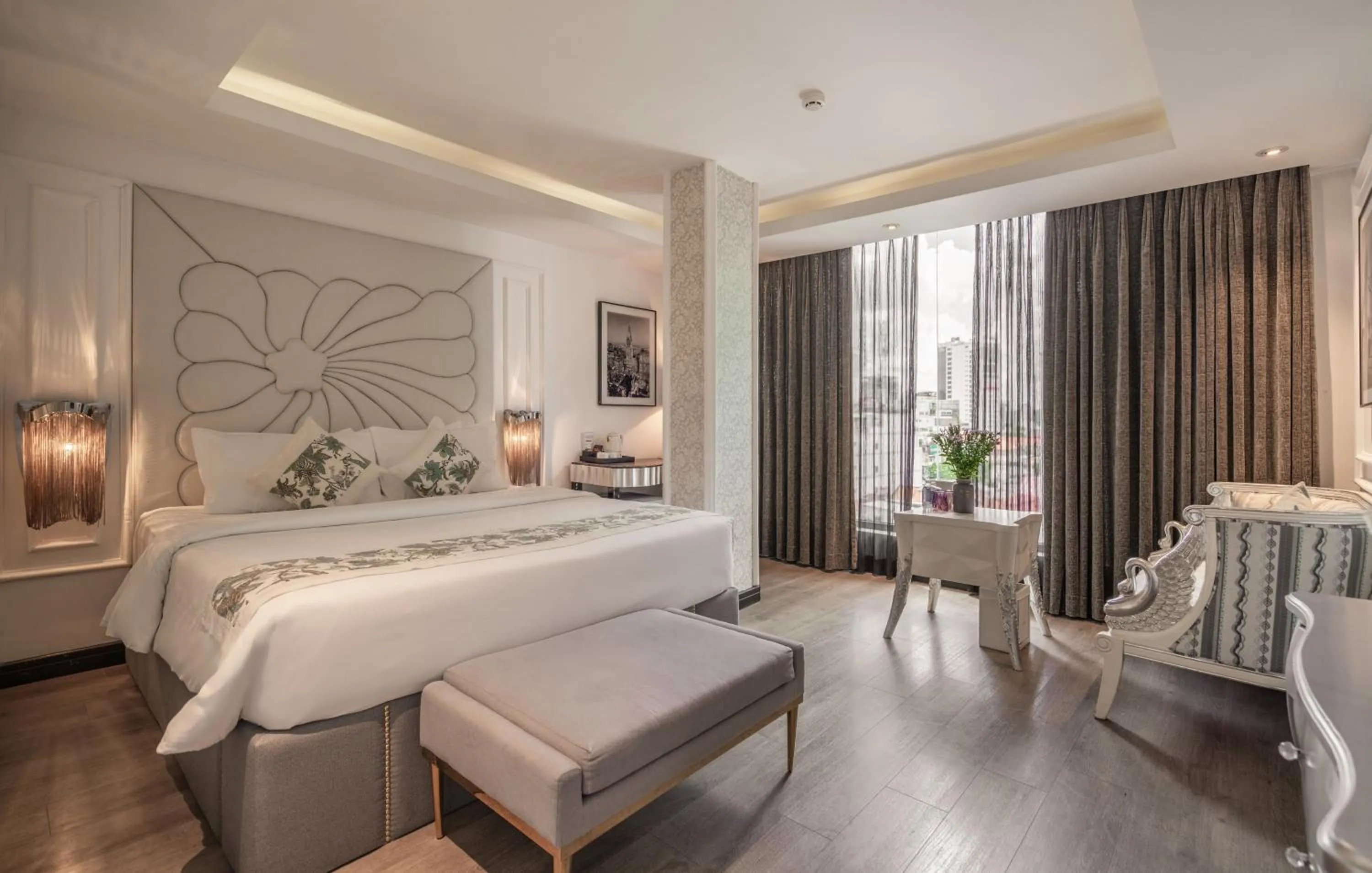 Bed in A&EM Saigon Hotel