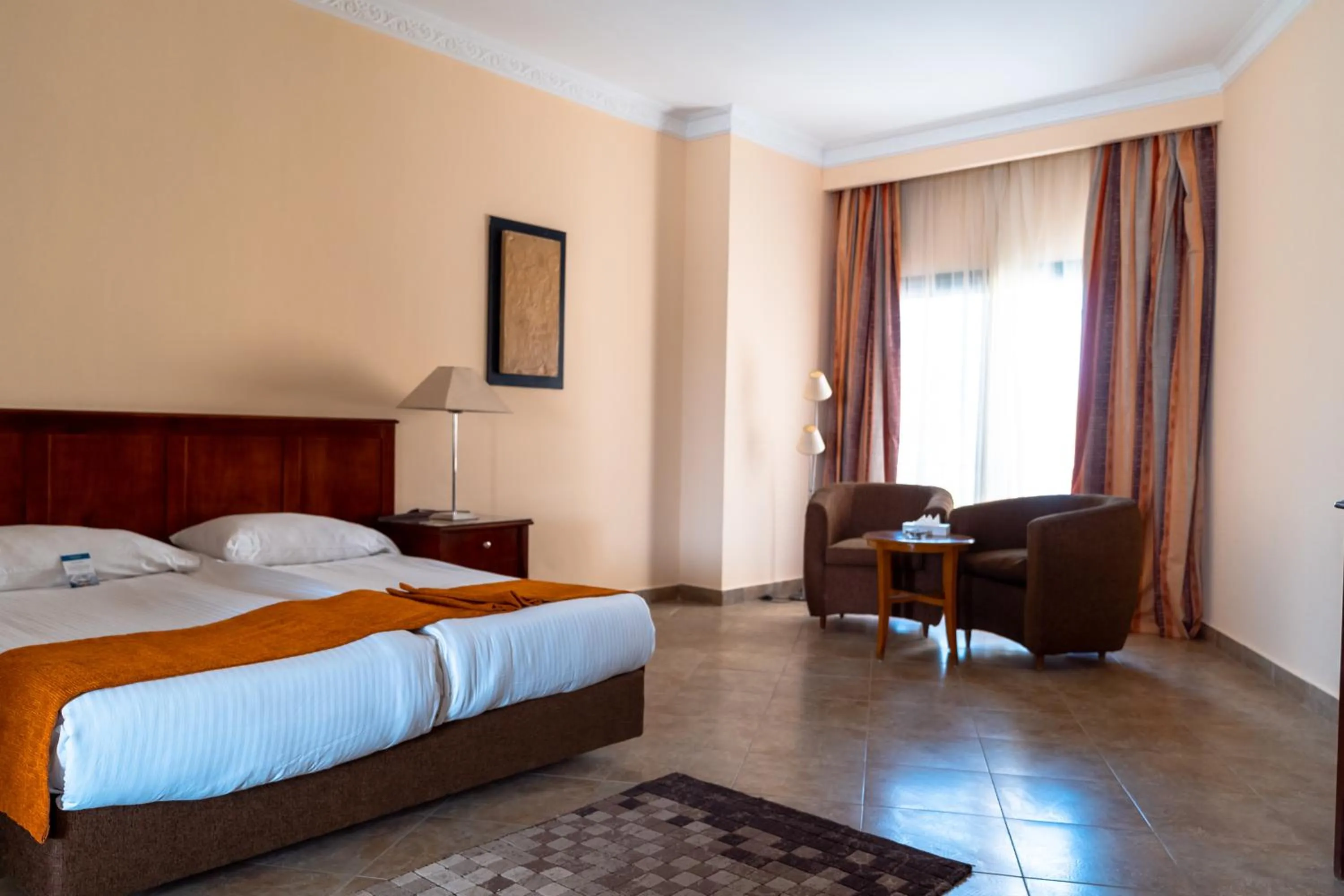 Bed in Swiss Inn Plaza Hotel