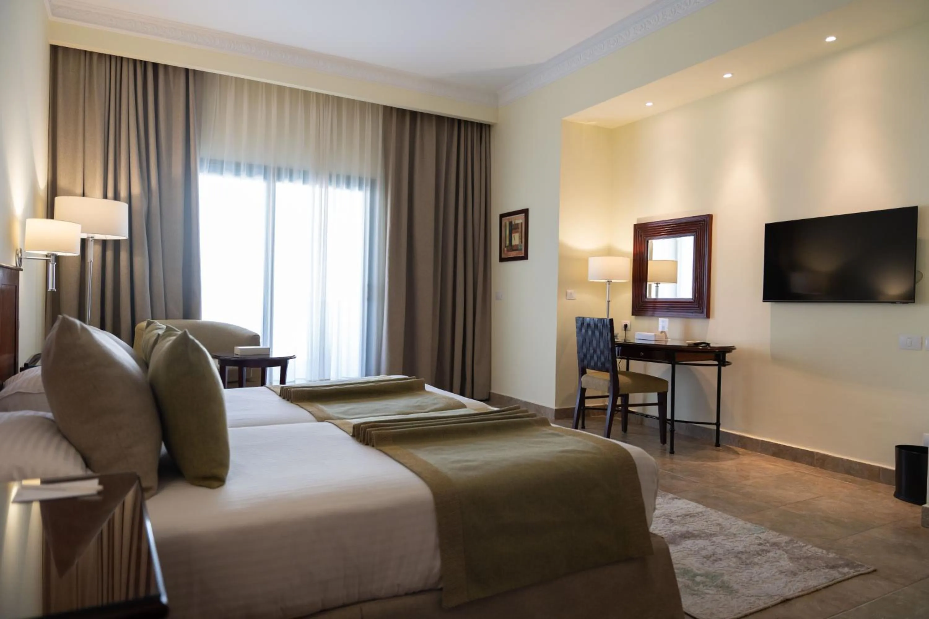 Bed in Swiss Inn Plaza Hotel