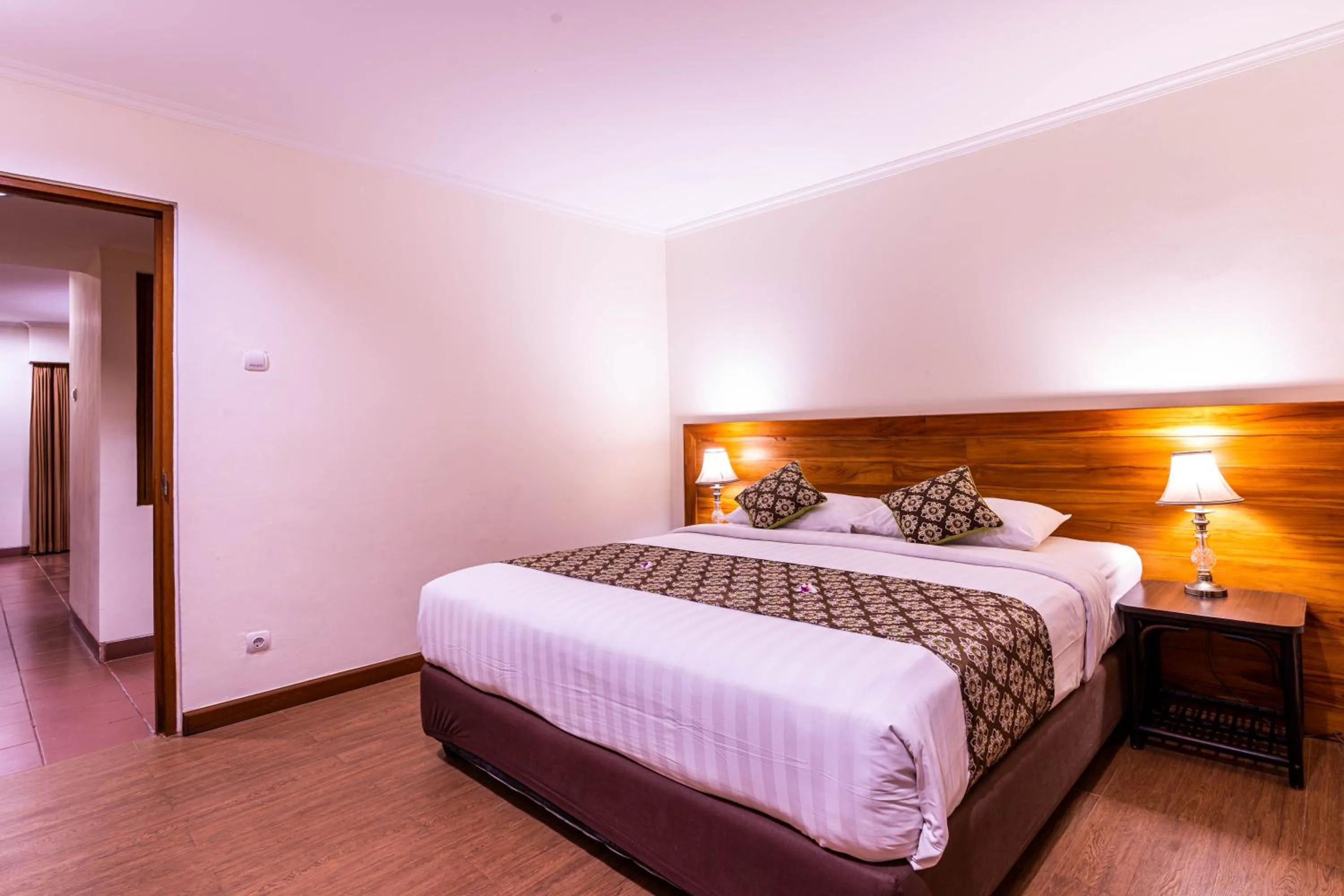 Bed in Plagoo Holiday Hotel