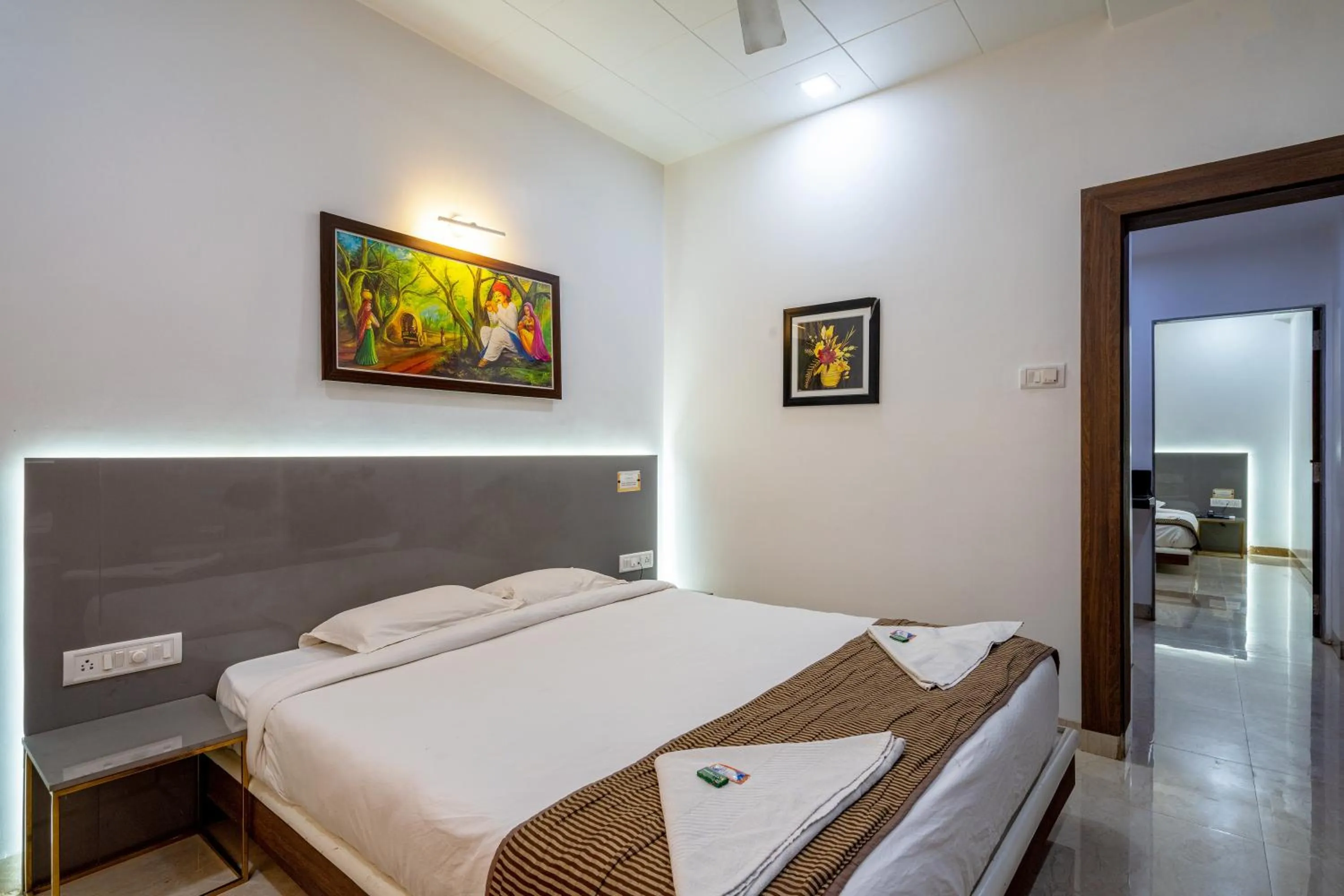 Bed in Hotel Darshan Executive