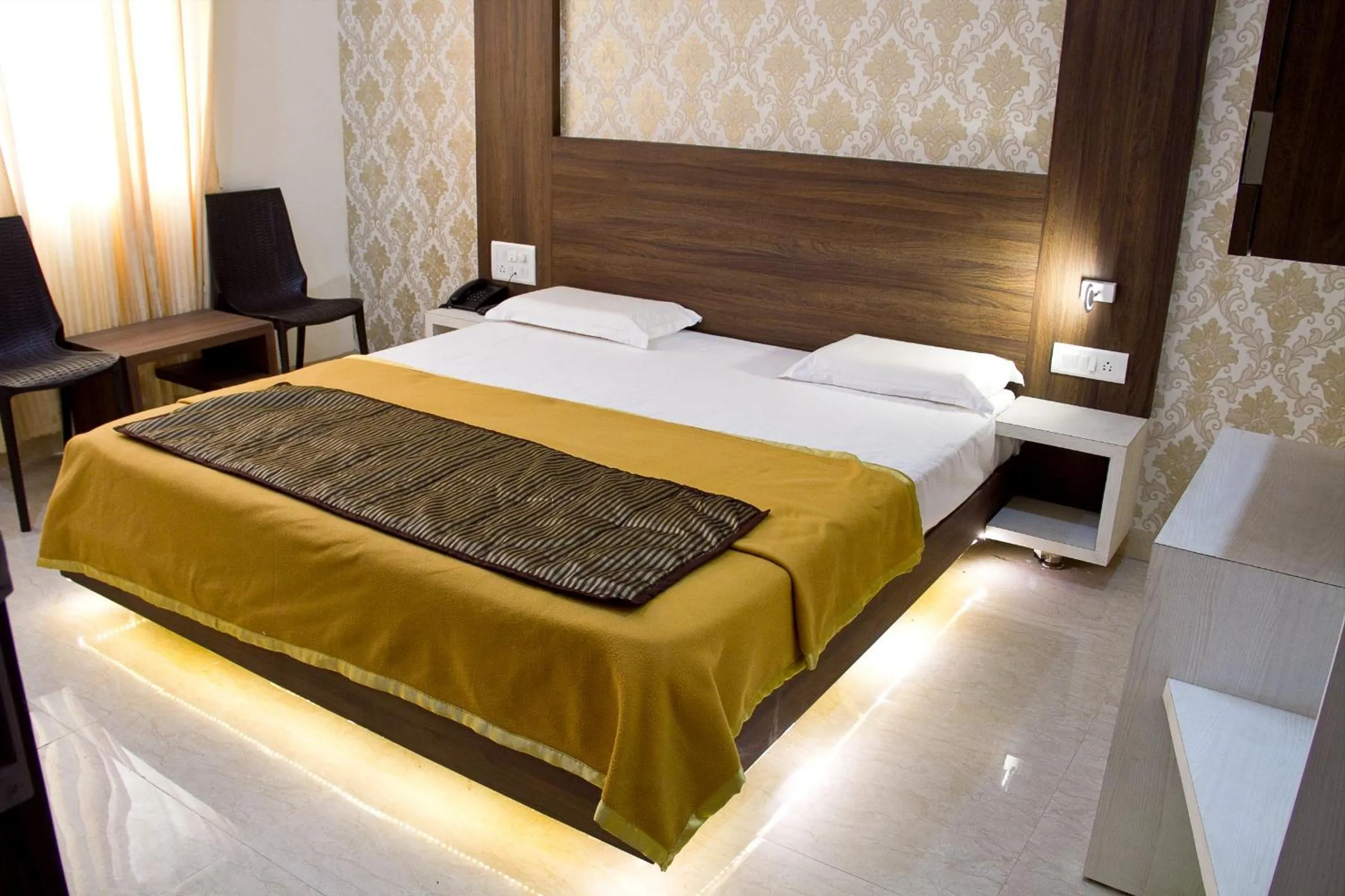 Bed in Hotel Darshan Executive