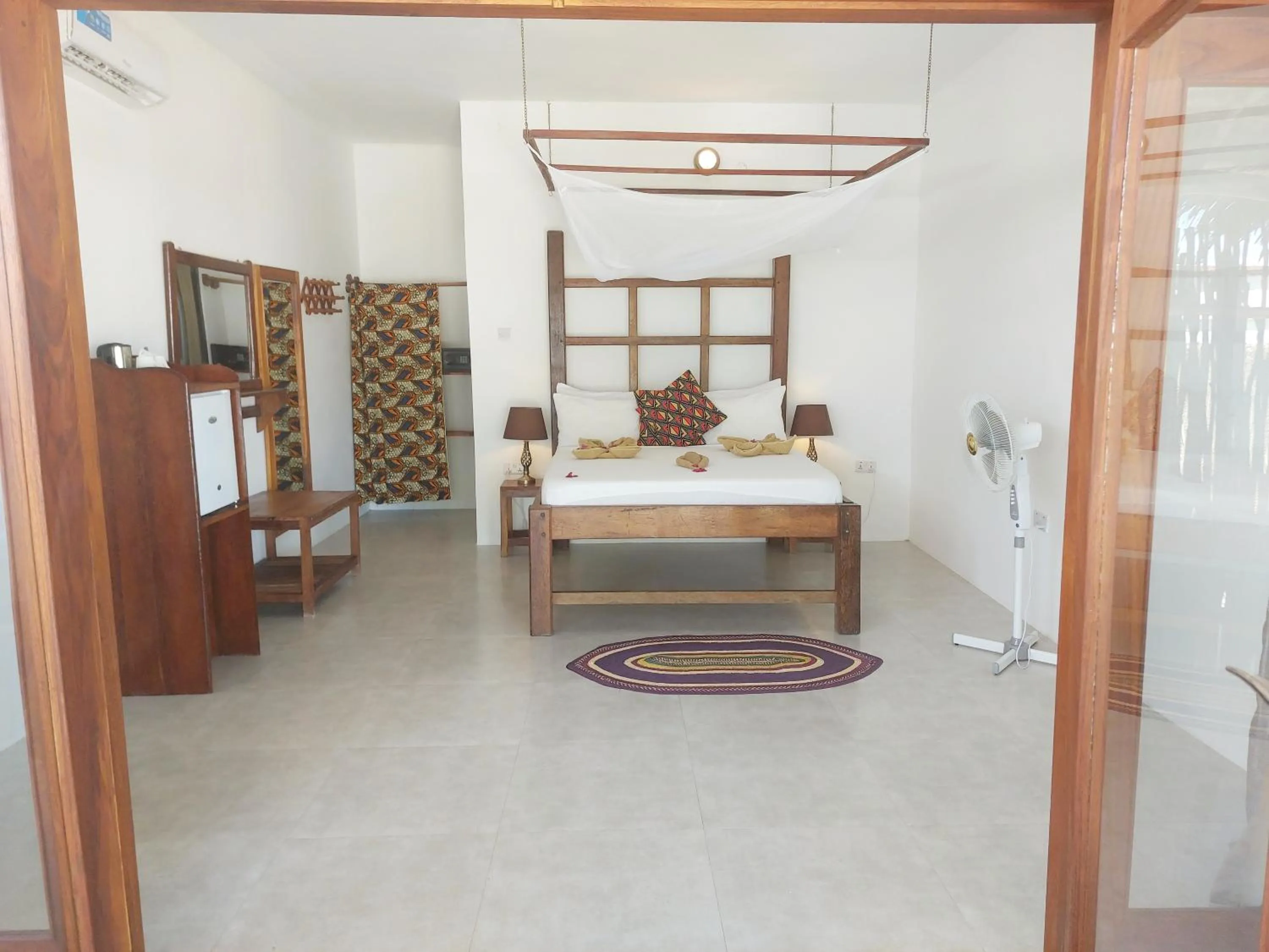 Bed in Jaribu Beach Hotel