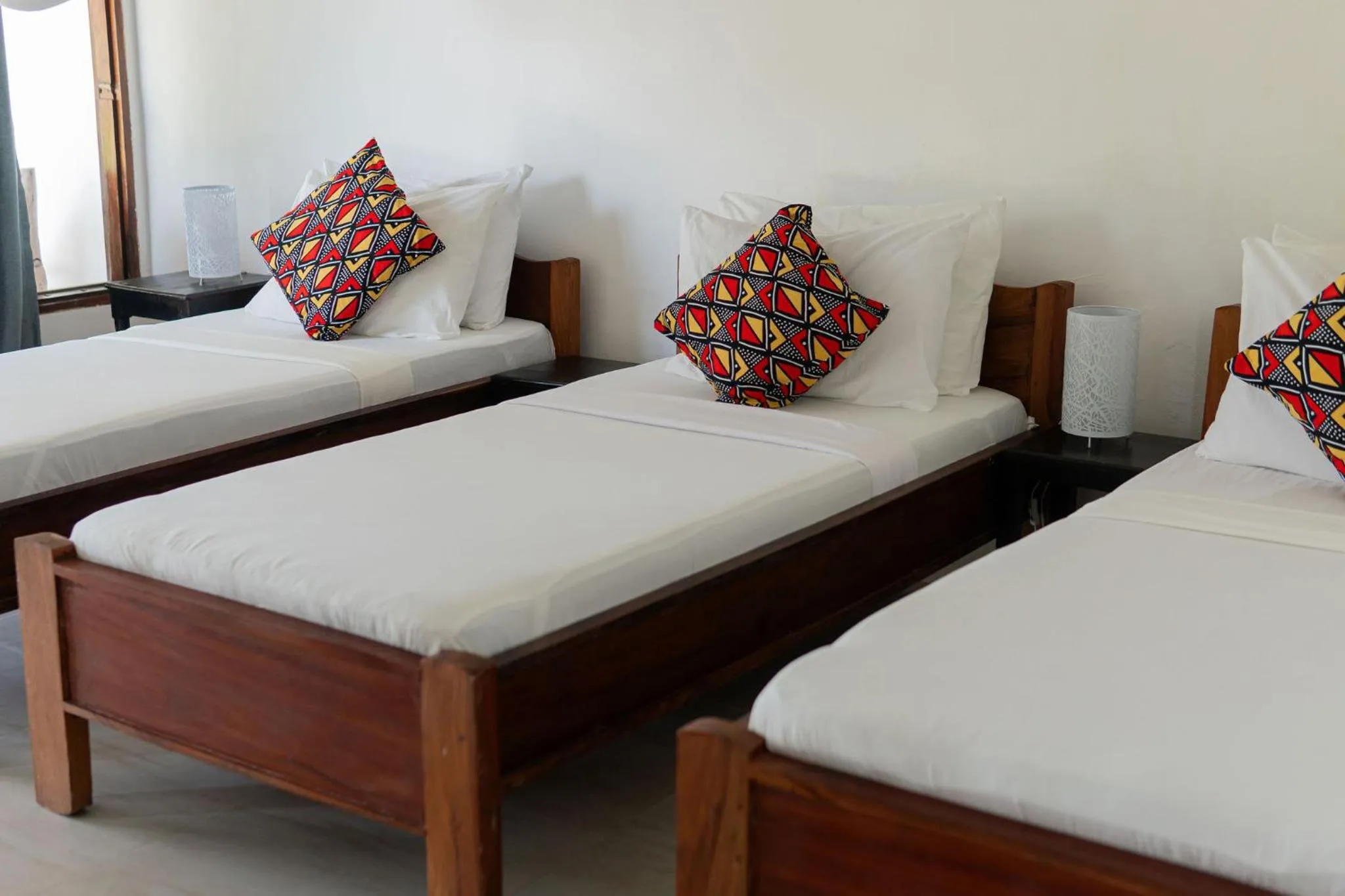 Bed in Jaribu Beach Hotel