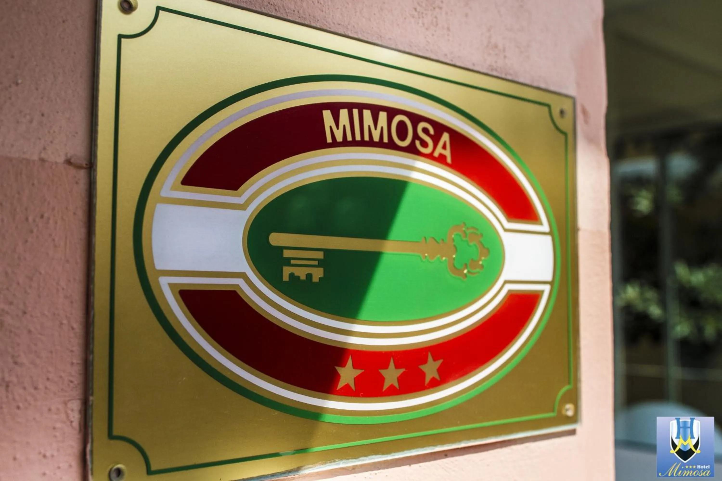 Property logo or sign in Hotel Mimosa