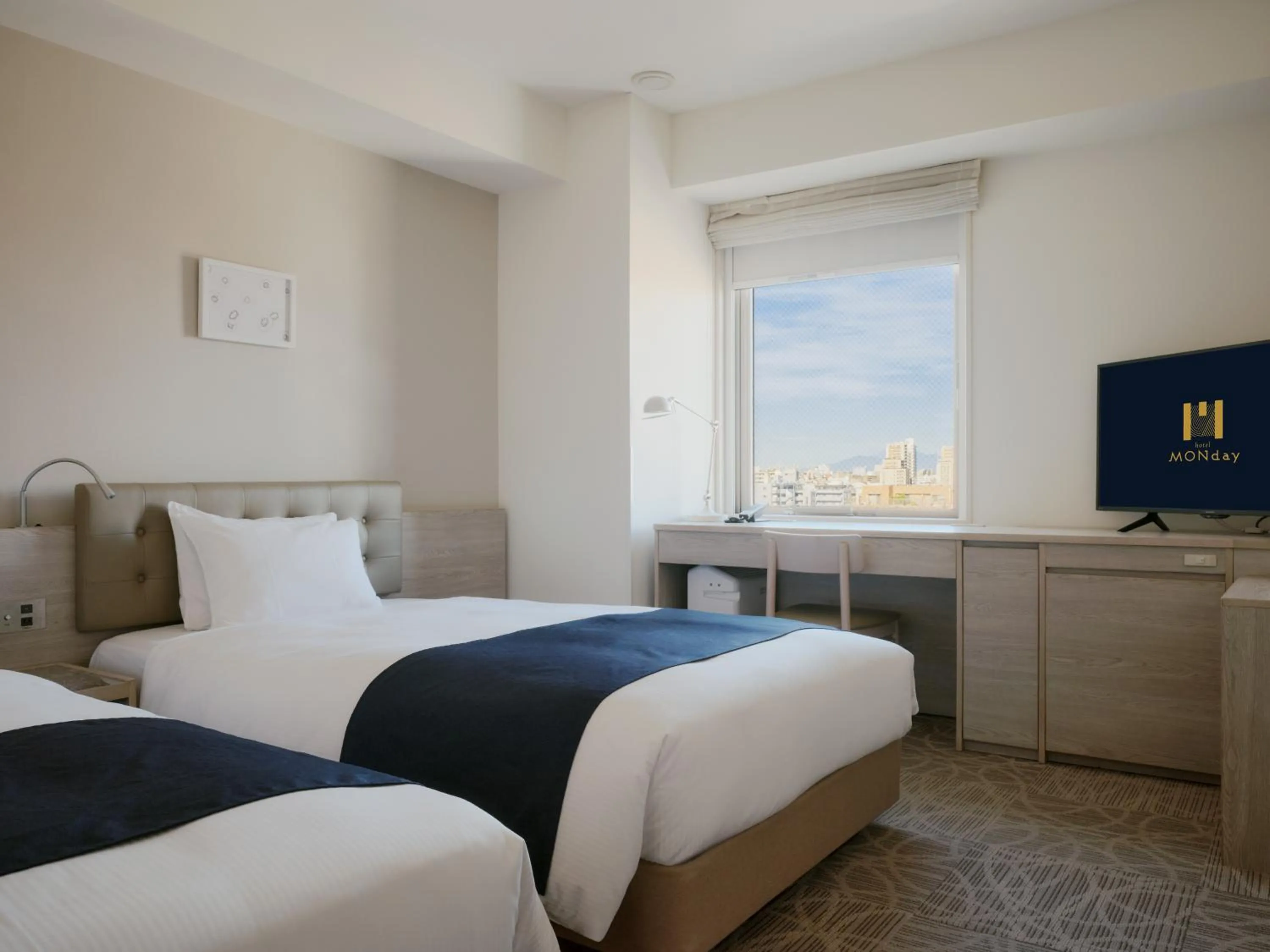 Bed in hotel MONday Haneda Airport