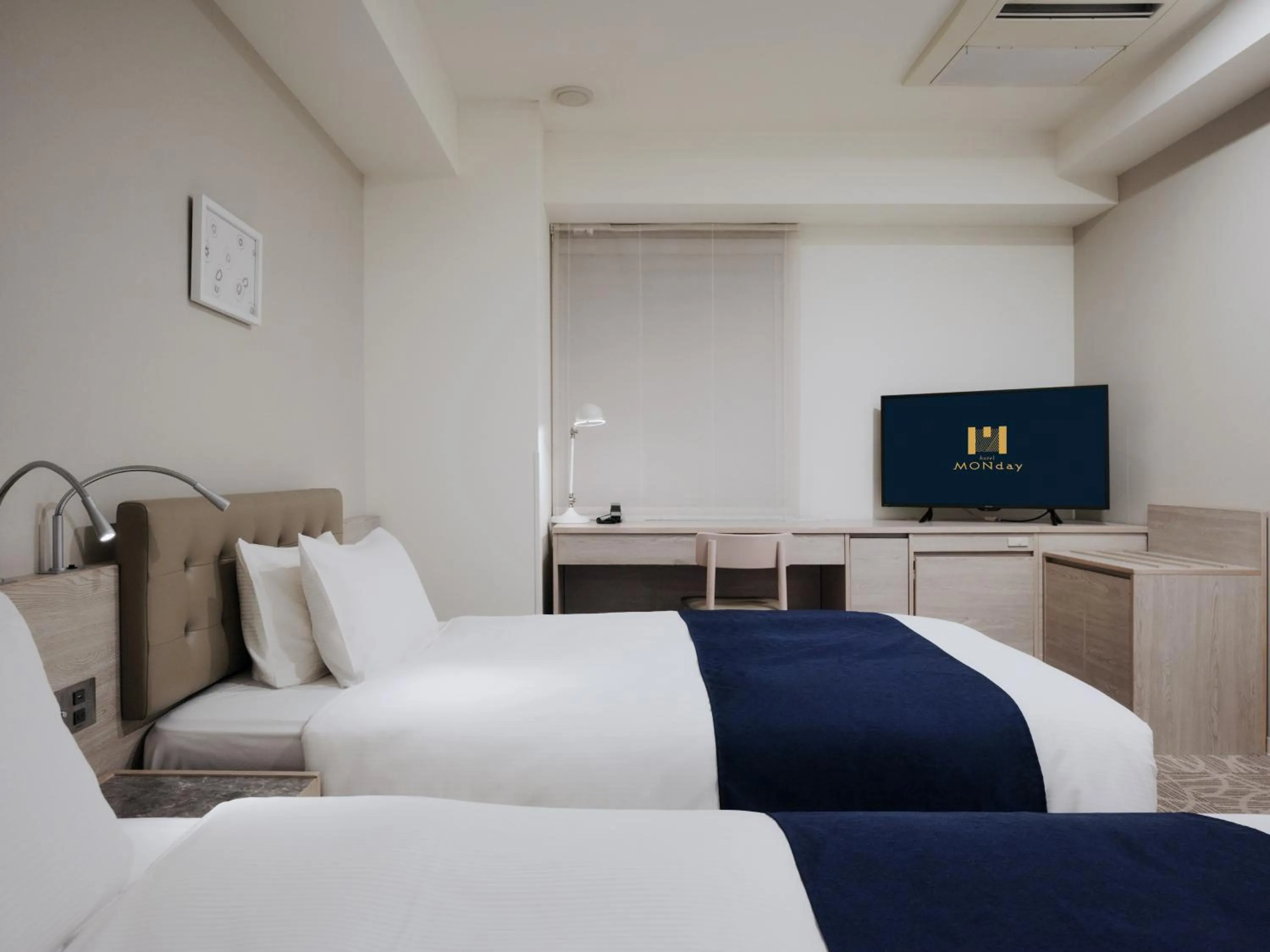 Bed in hotel MONday Haneda Airport