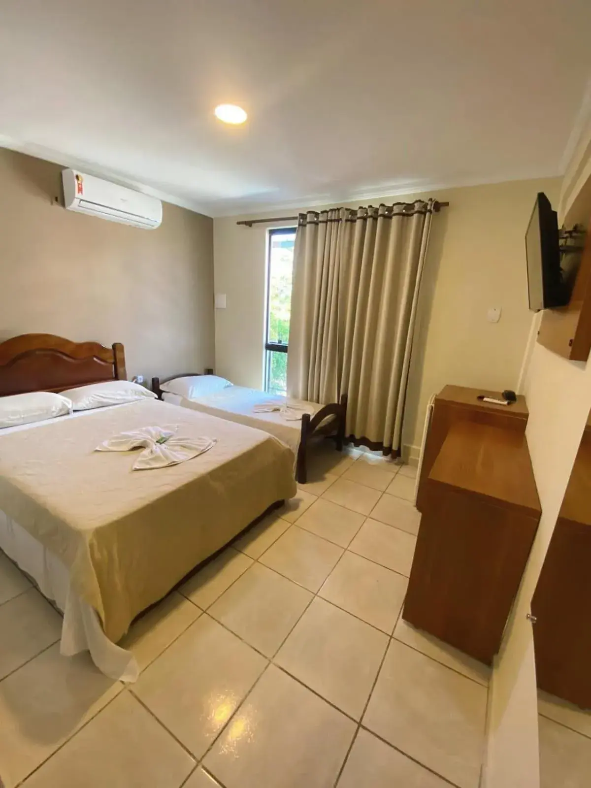 Deluxe Triple Room in Pousada Dom Fernandes Deluxe Triple Room in Pousada Dom Fernandes