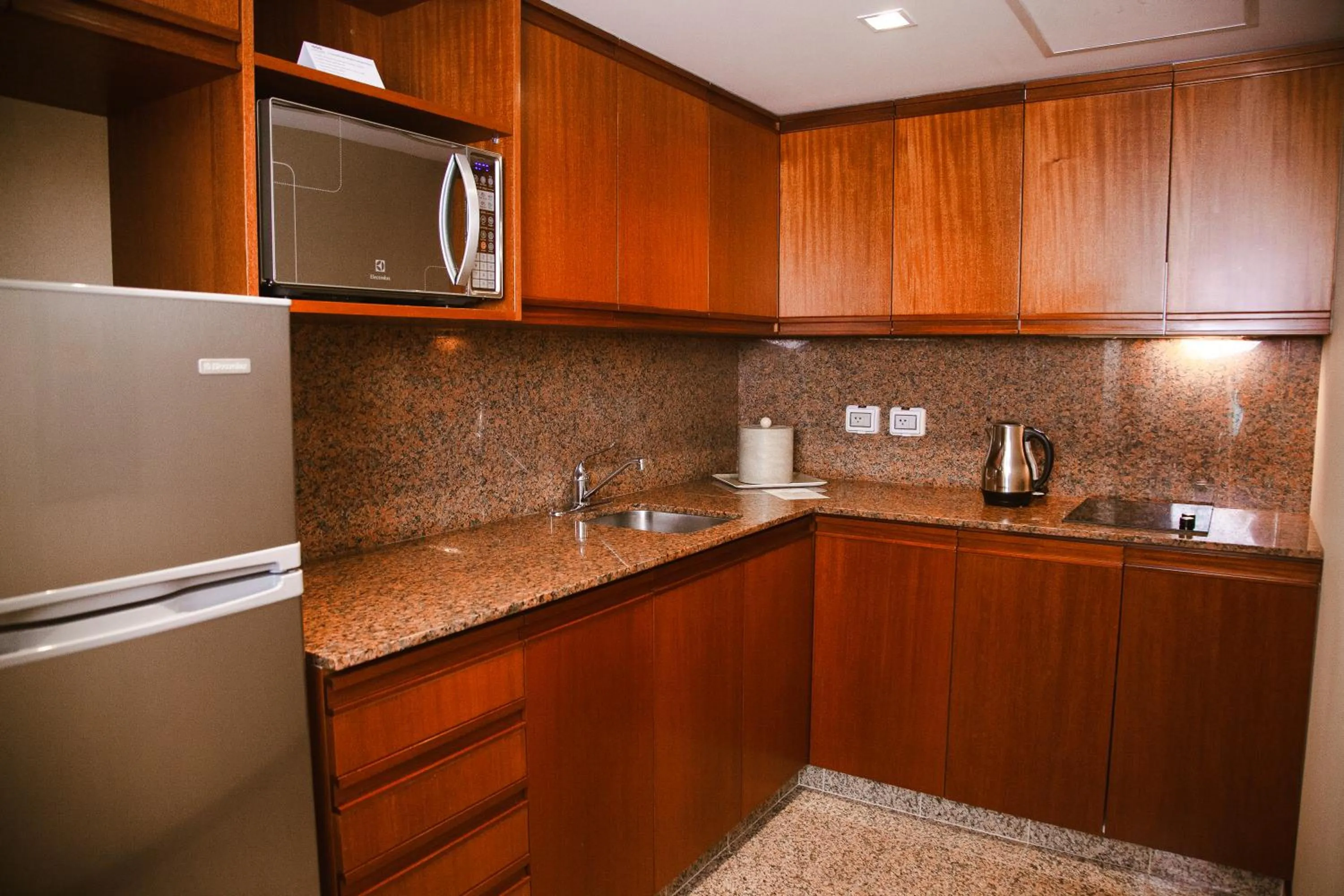 Kitchen or kitchenette in Los Tallanes Hotel & Suites