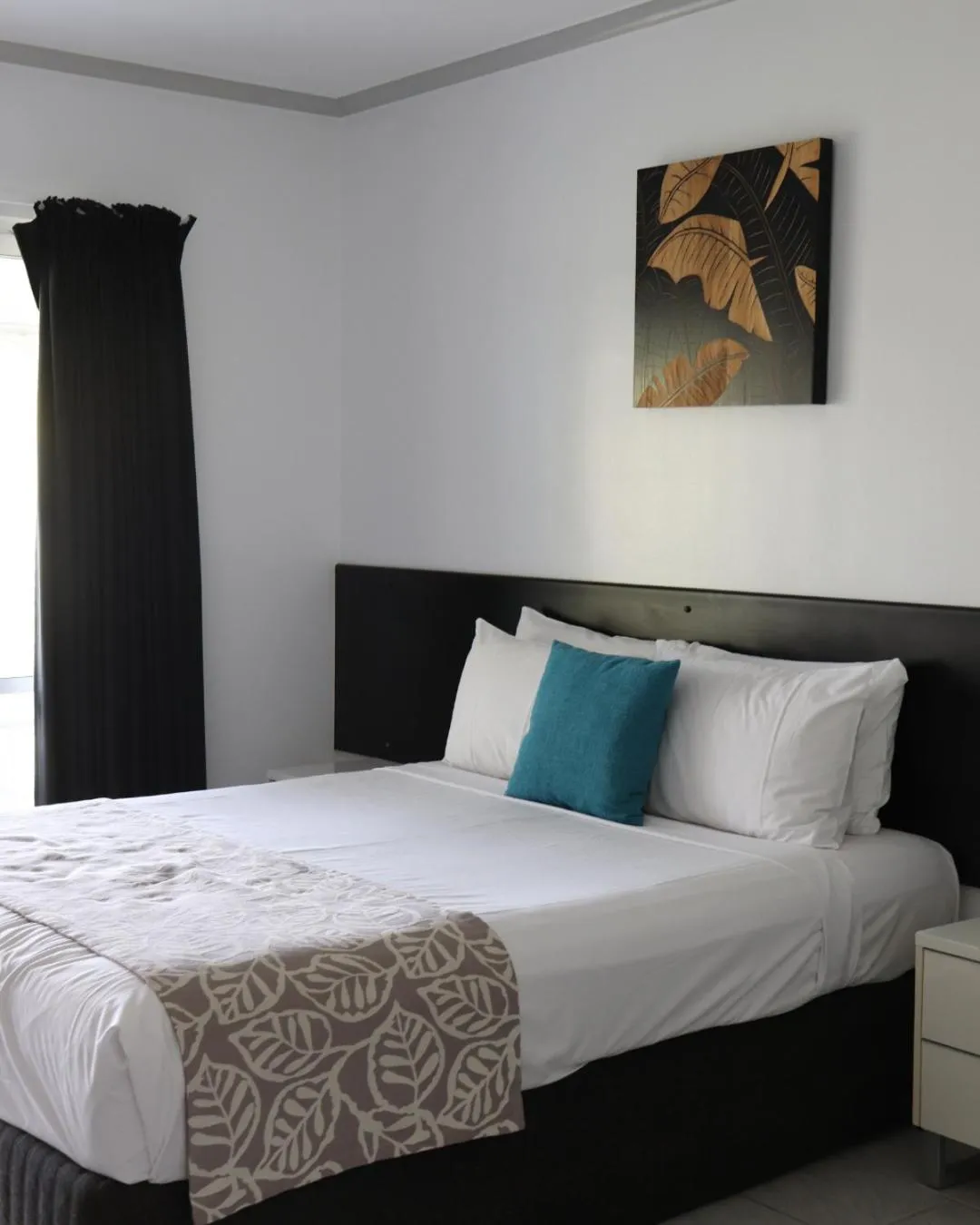 Bed in Colonial Palms Motor Inn