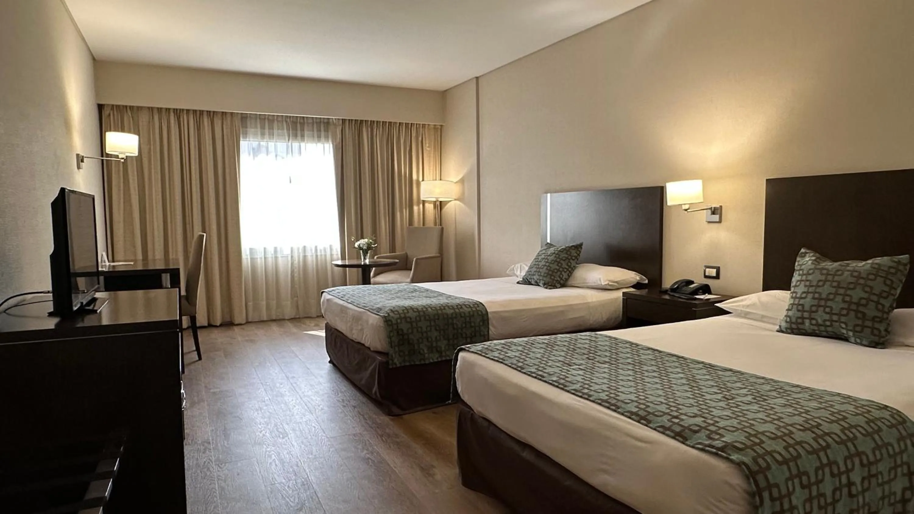 Bed in Land Plaza Hotel