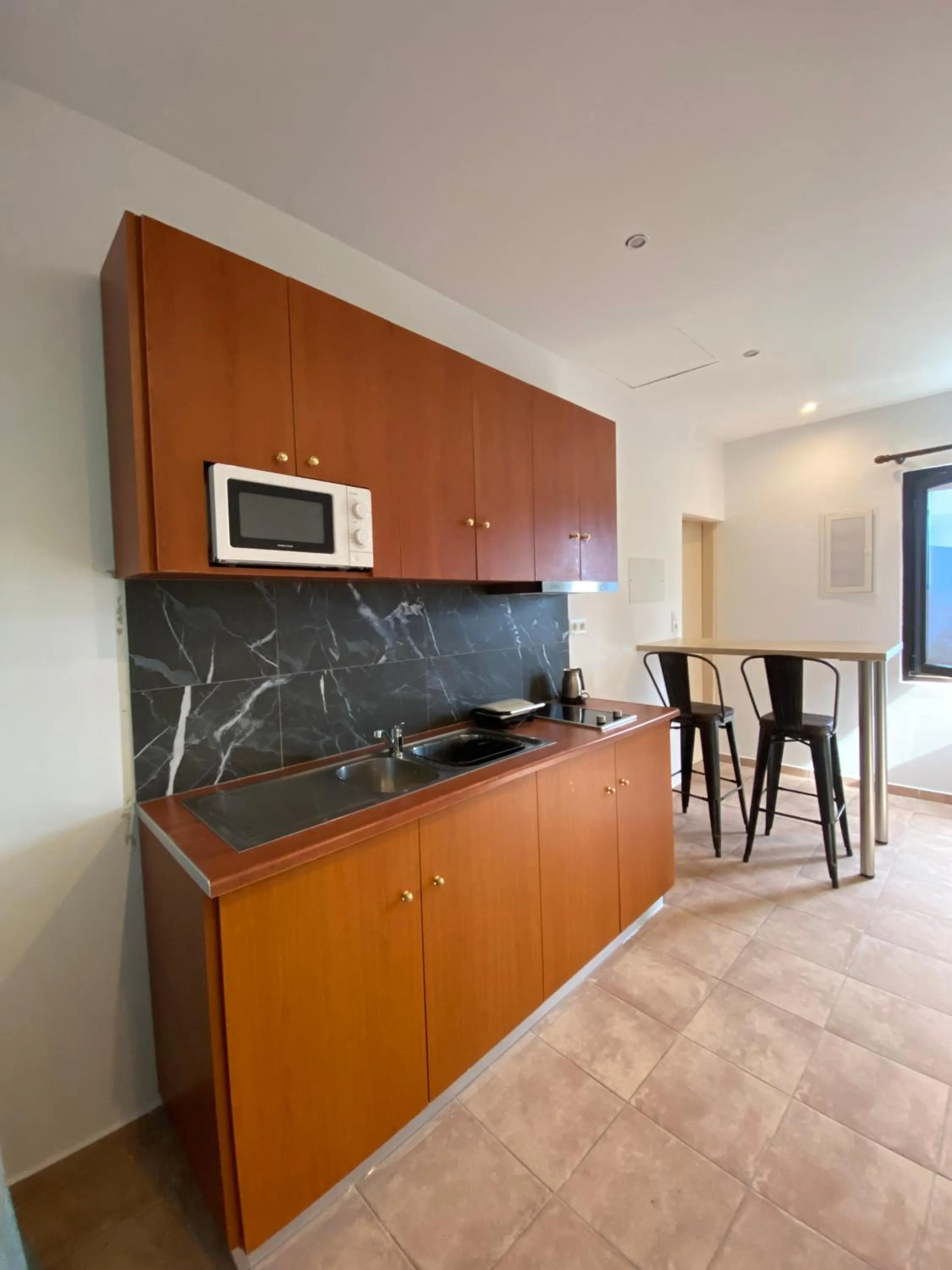 Kitchen or kitchenette in Bungalow - Camping Apollon