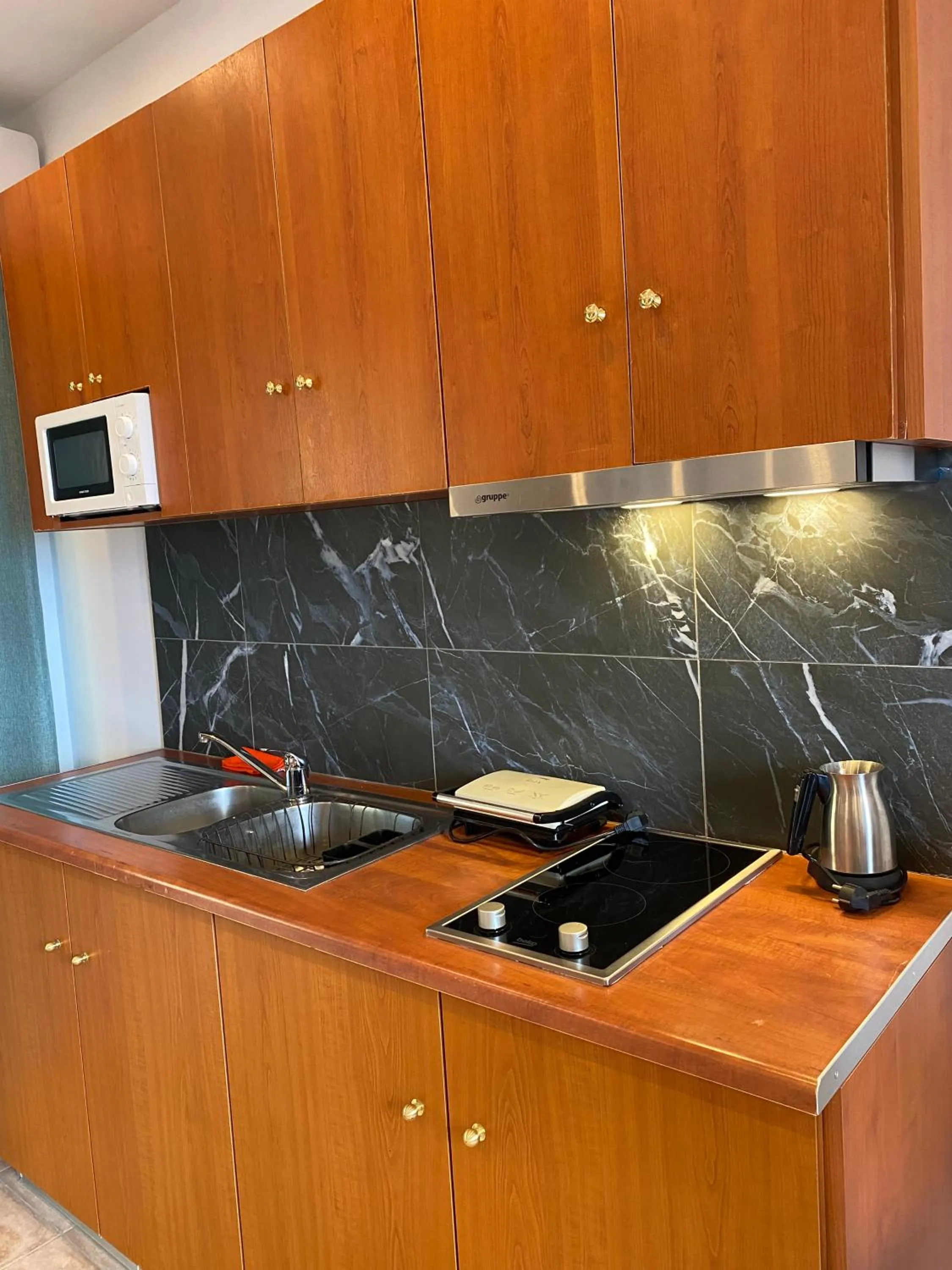 Kitchen or kitchenette in Bungalow - Camping Apollon