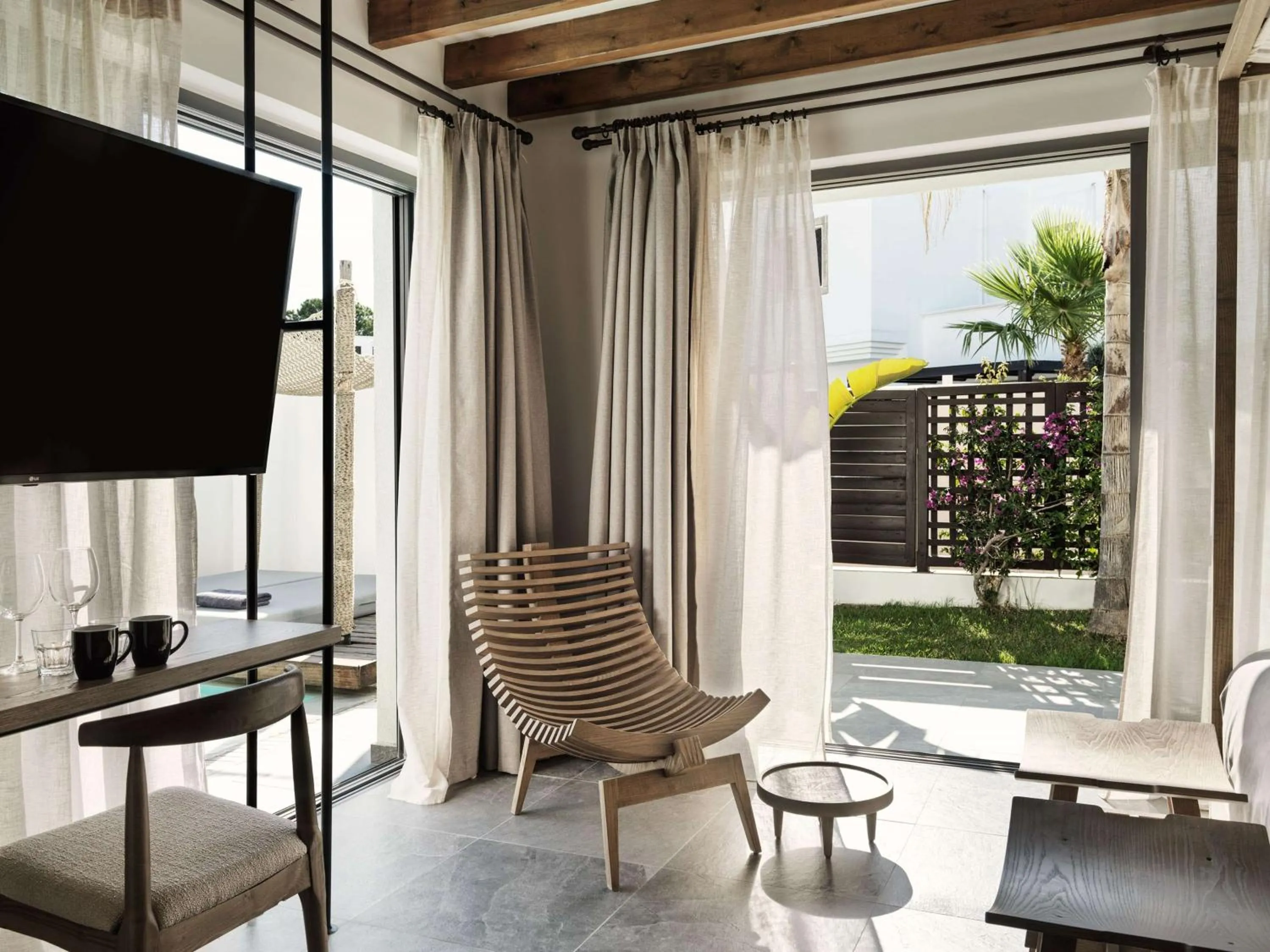 Living room in Aulūs Lindos Rhodes, Curio Collection by Hilton