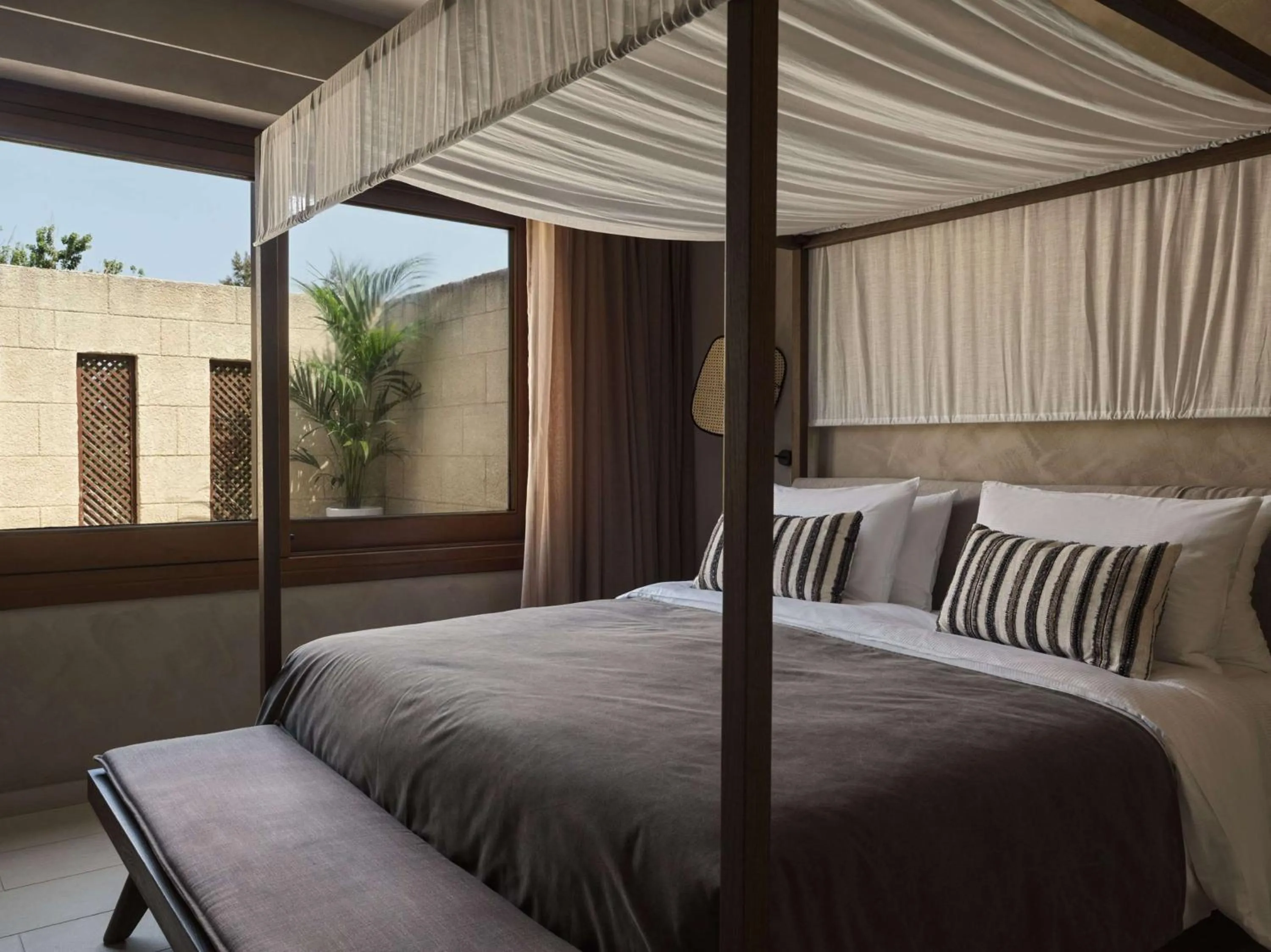 Bed in Aulūs Lindos Rhodes, Curio Collection by Hilton