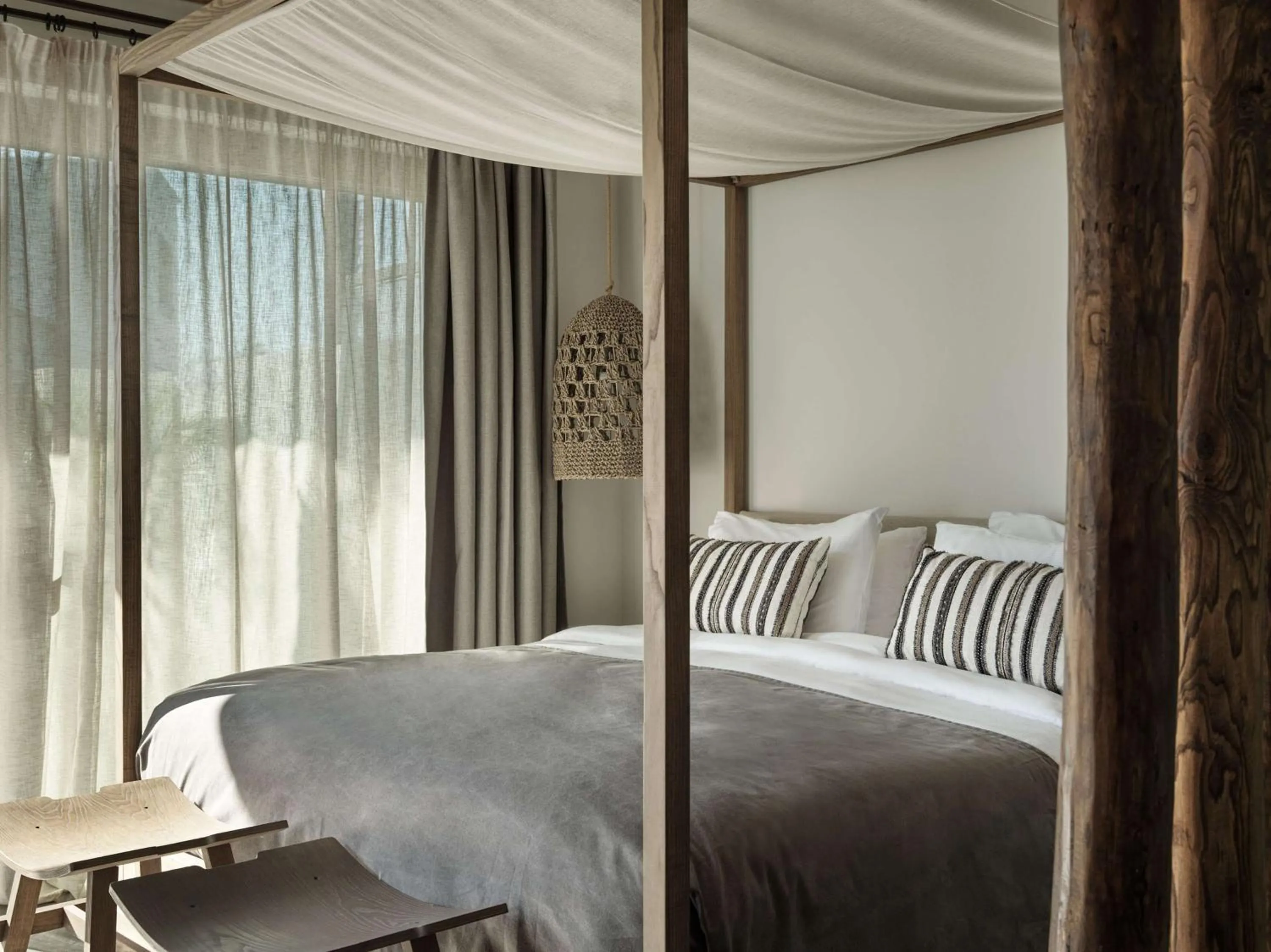 Bed in Aulūs Lindos Rhodes, Curio Collection by Hilton