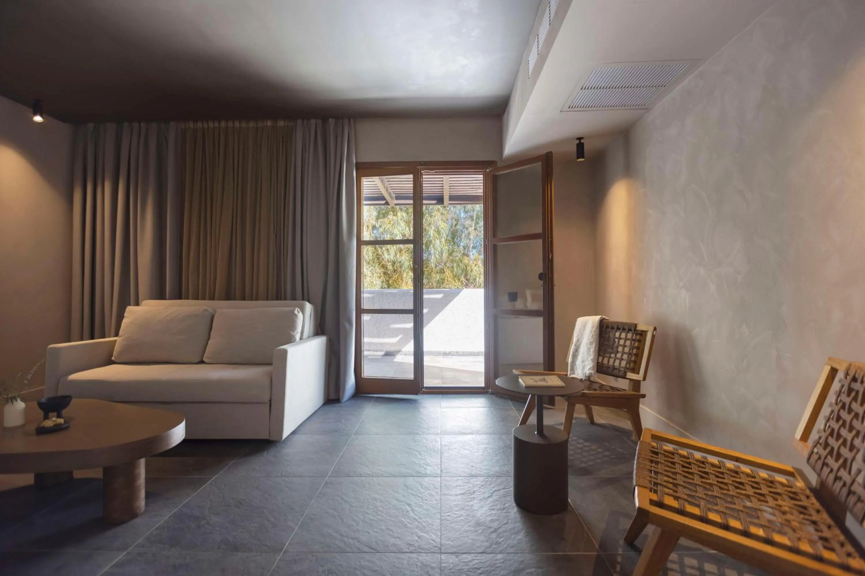 Living room in Aulūs Lindos Rhodes, Curio Collection by Hilton