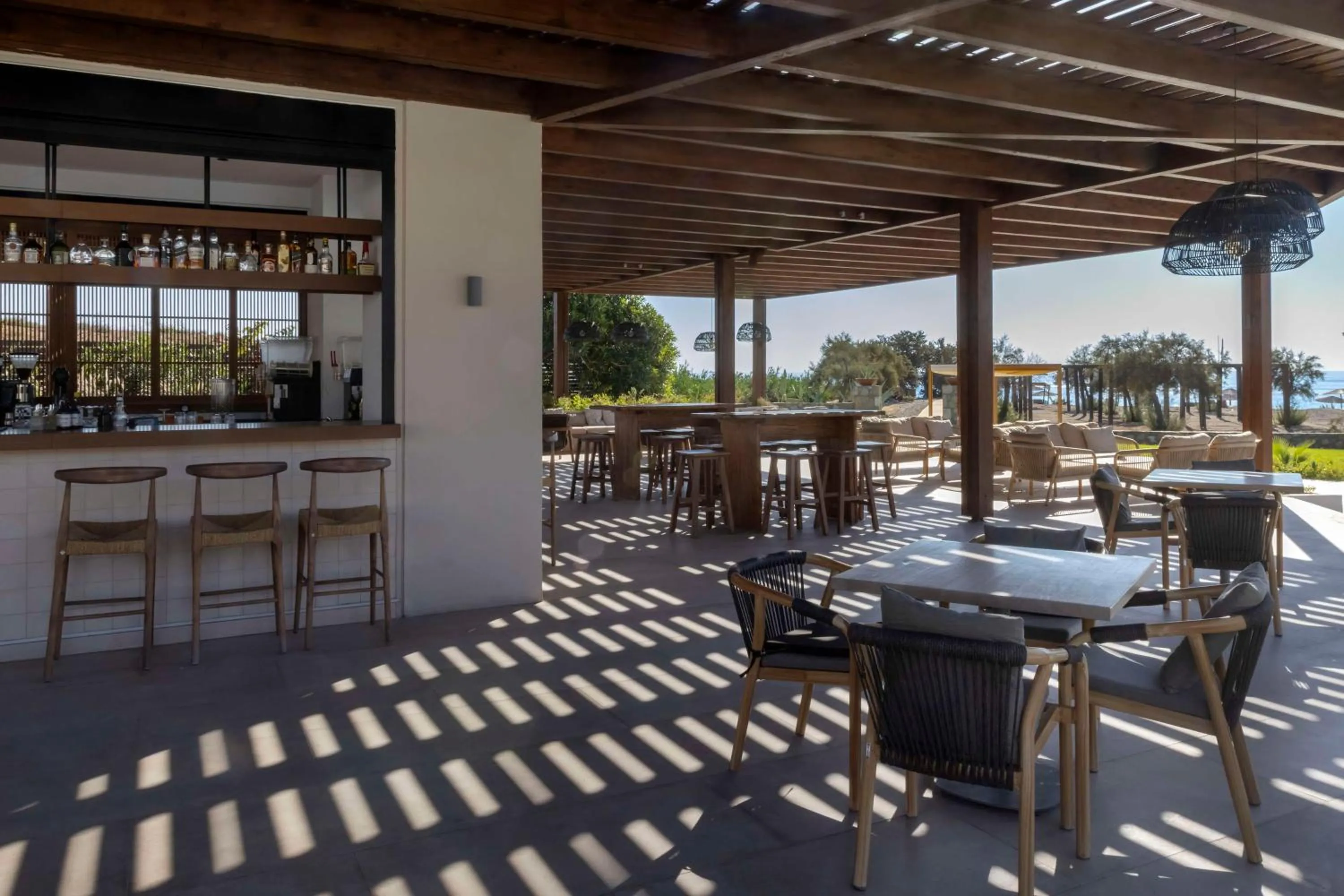 Lounge or bar in Aulūs Lindos Rhodes, Curio Collection by Hilton