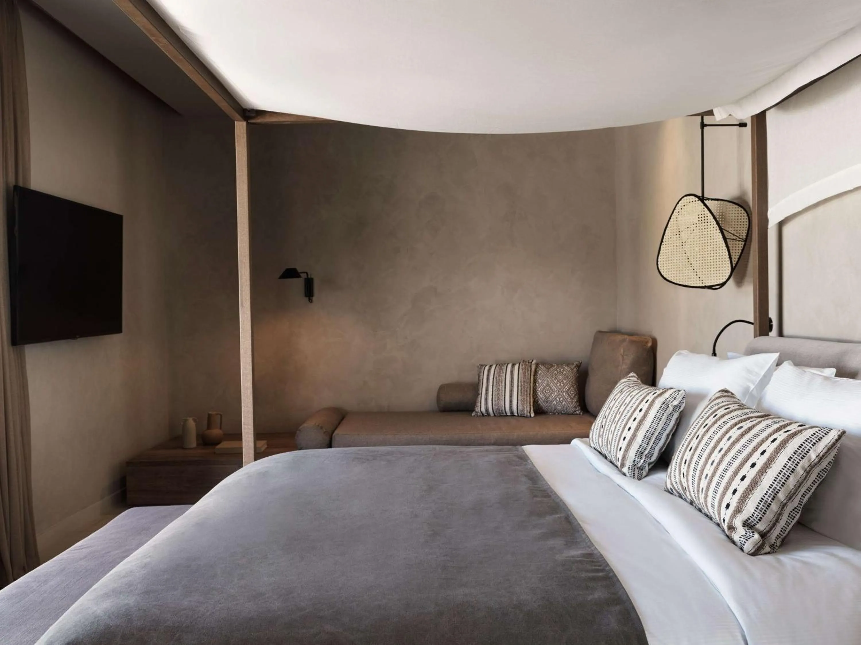 Bed in Aulūs Lindos Rhodes, Curio Collection by Hilton