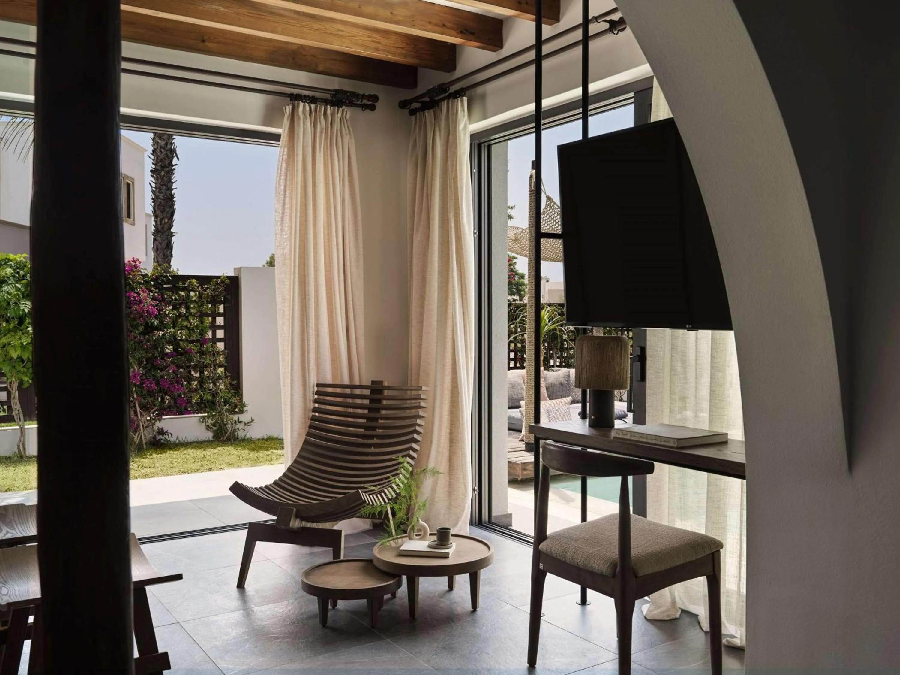 Living room in Aulūs Lindos Rhodes, Curio Collection by Hilton