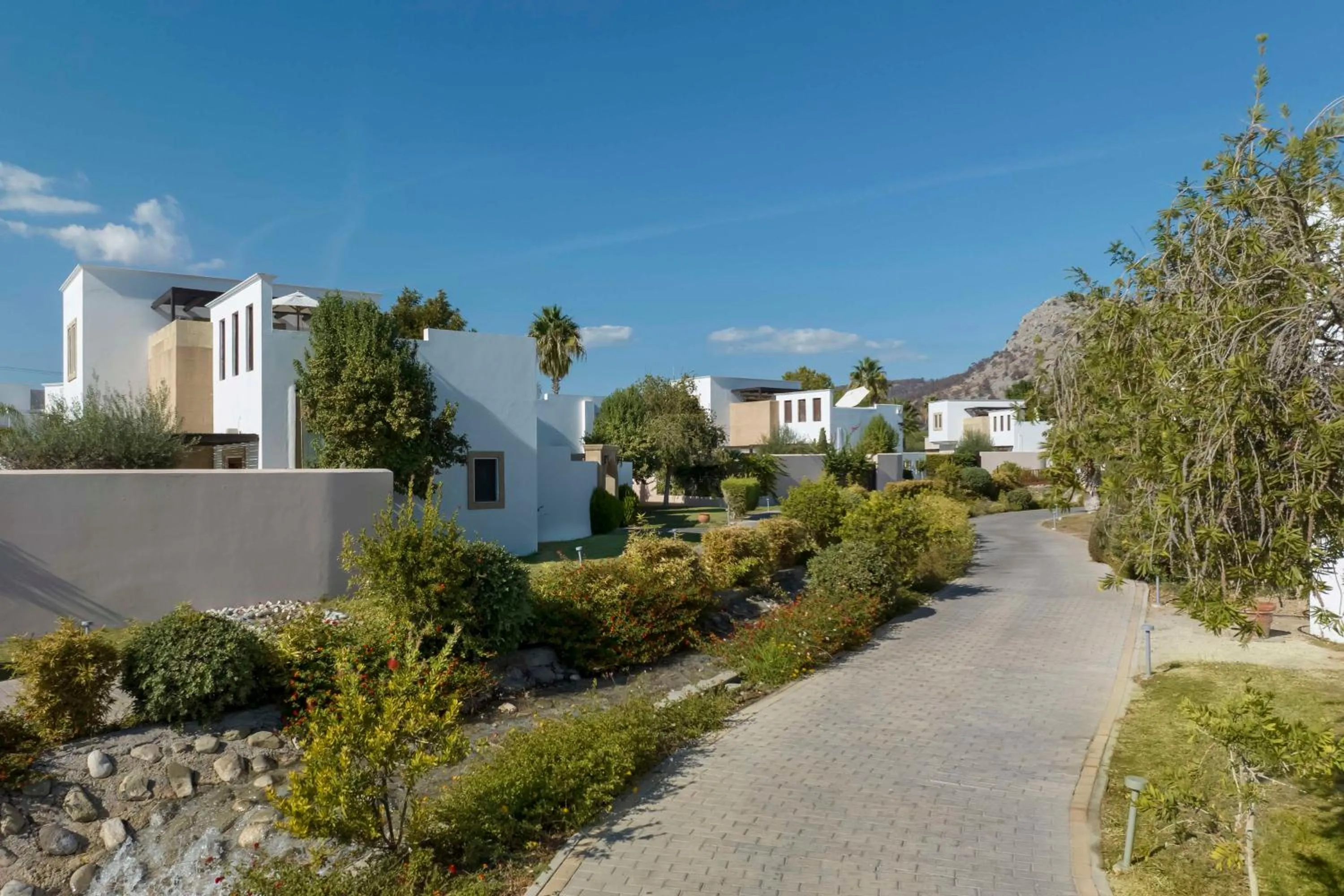 Property building in Aulūs Lindos Rhodes, Curio Collection by Hilton