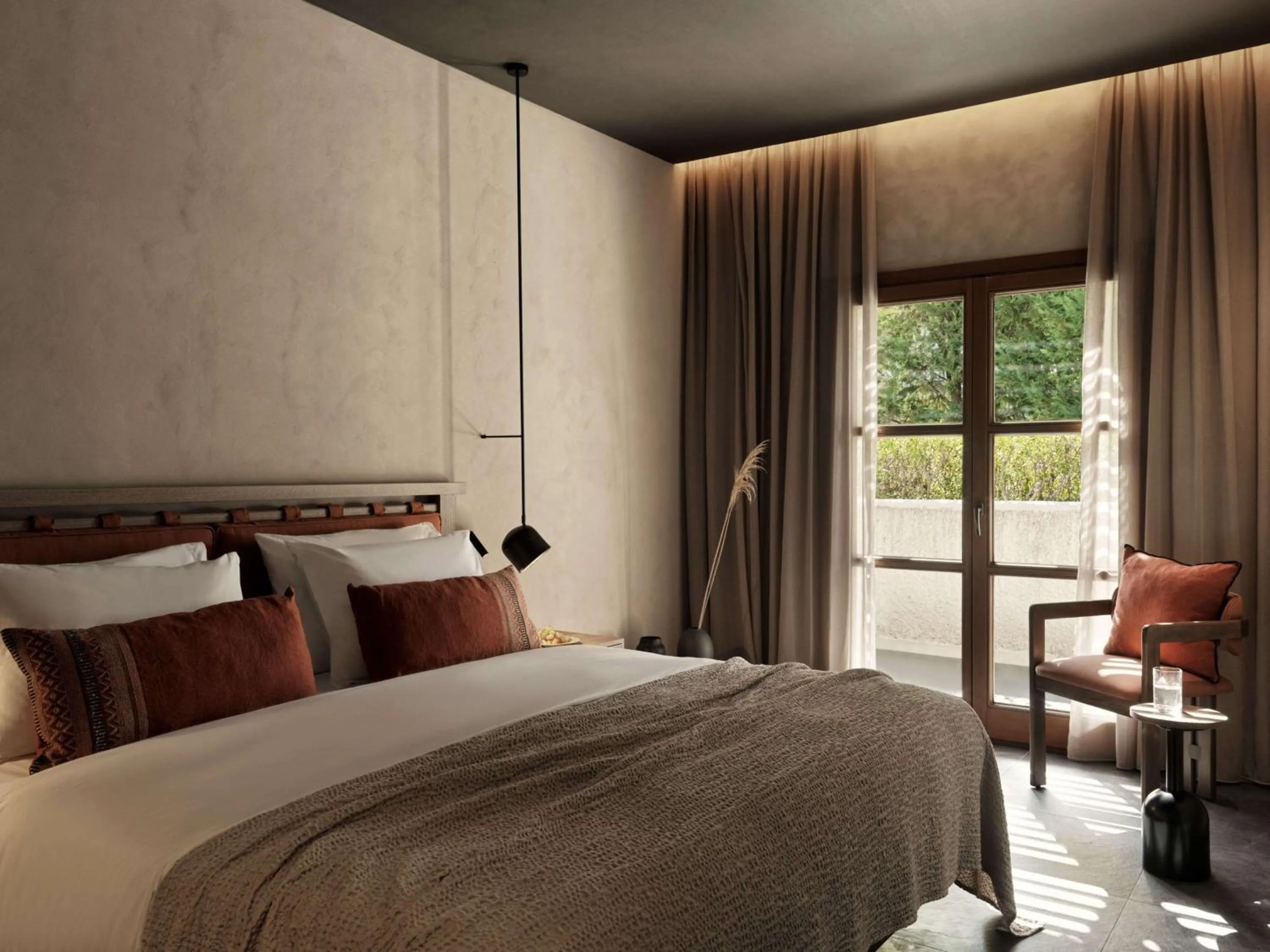 Bed in Aulūs Lindos Rhodes, Curio Collection by Hilton