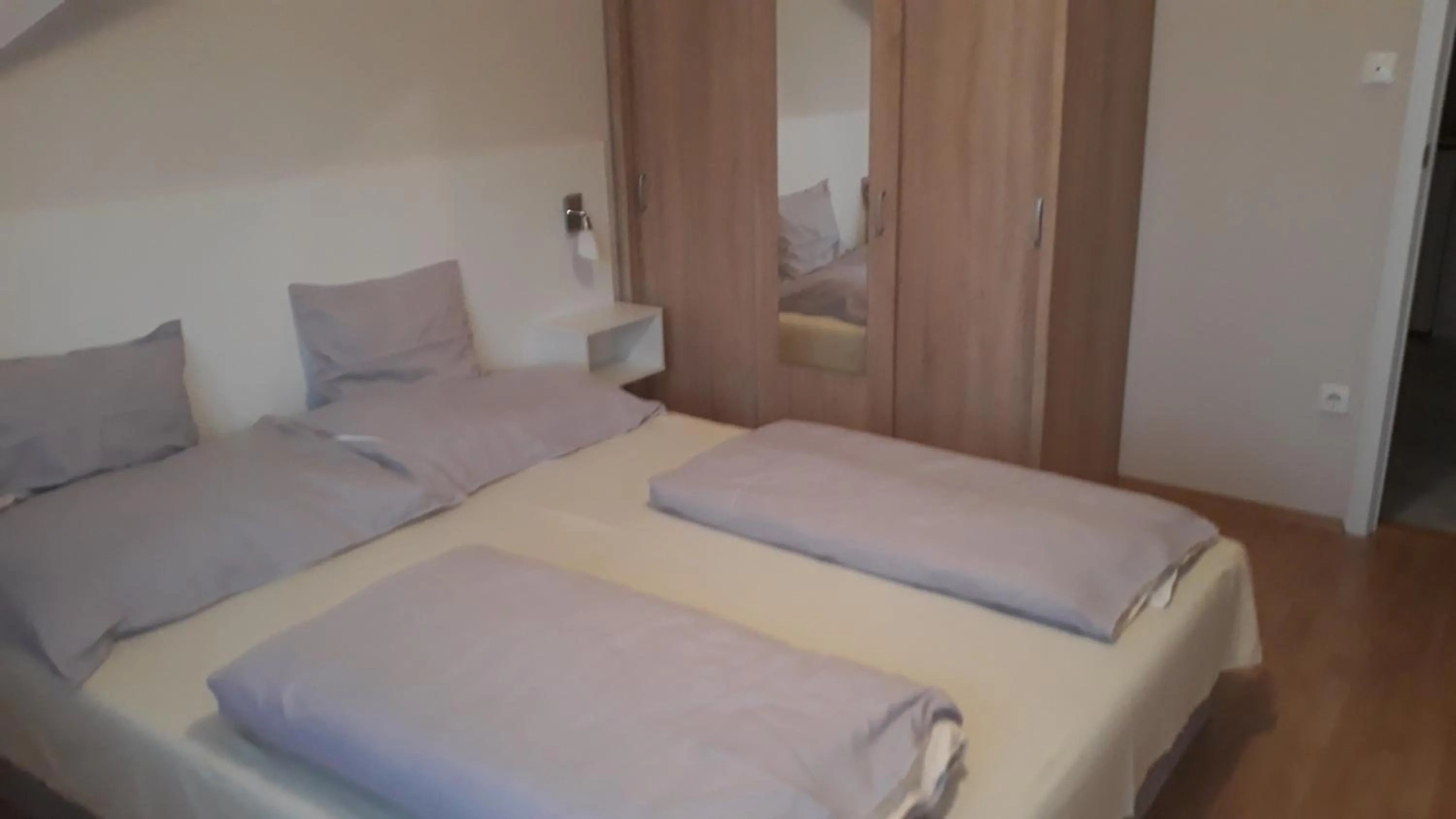 Bed in Szalóky Apartmanház