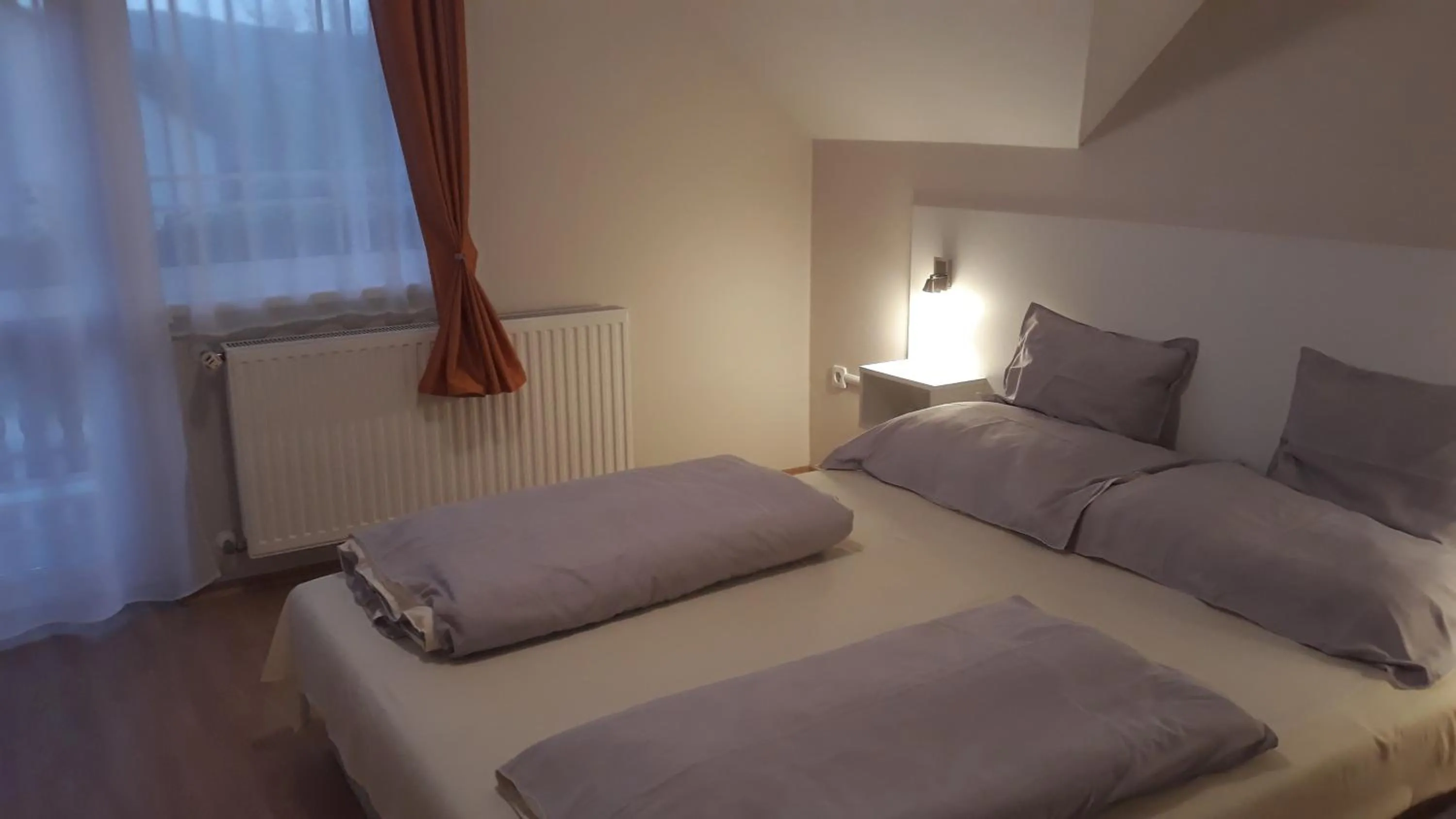 Bed in Szalóky Apartmanház