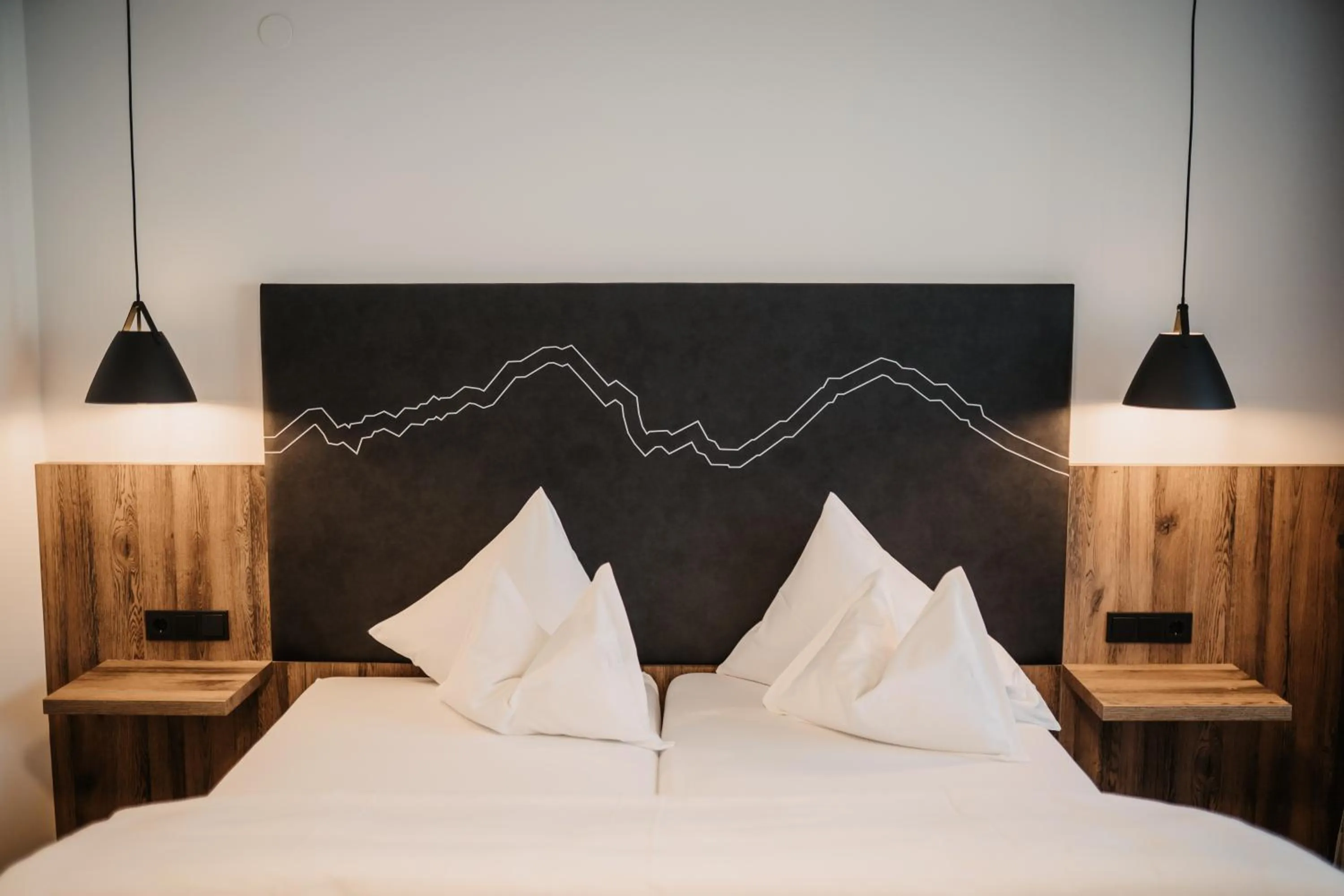 Bed in Hotel Neubergerhof