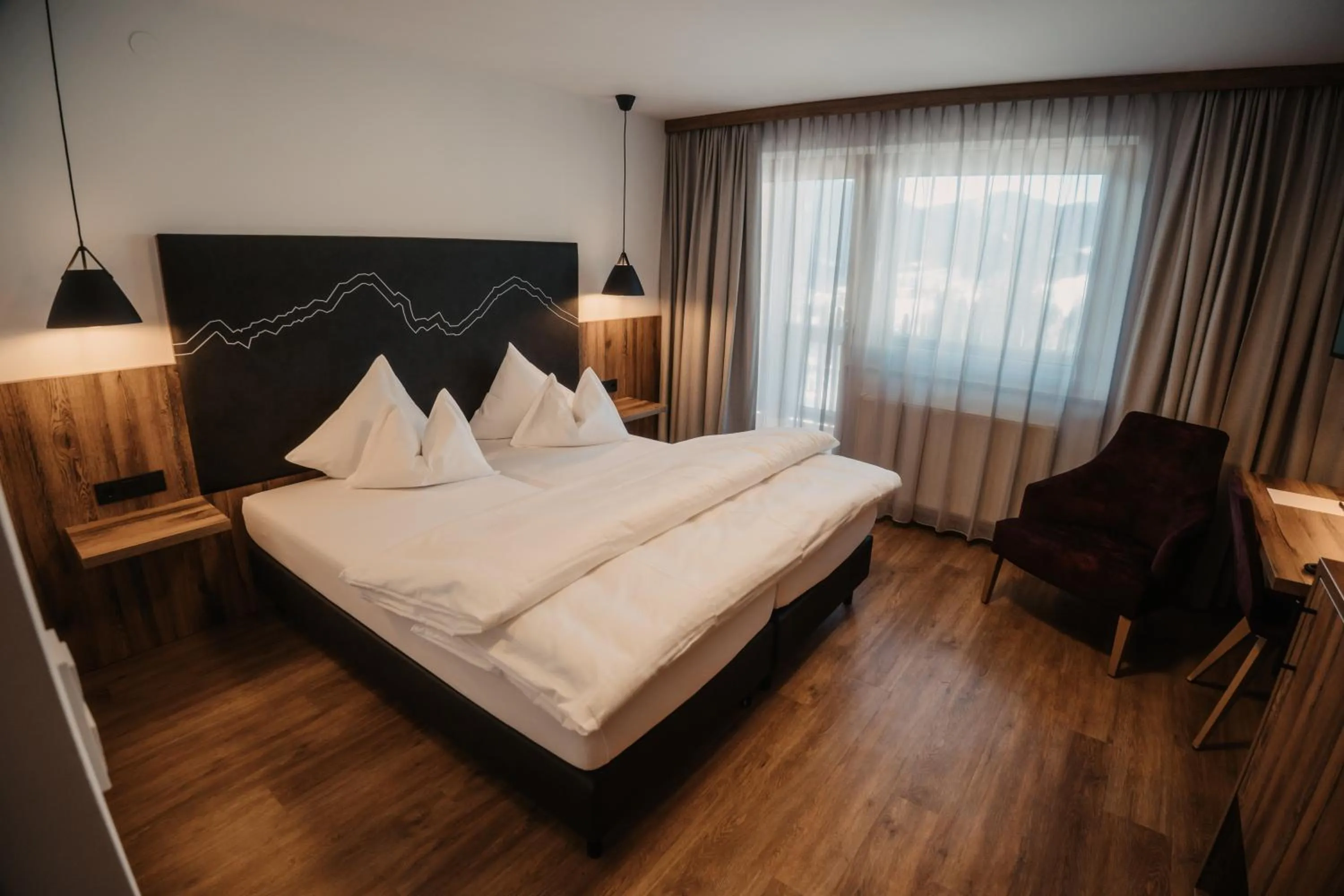 Bed in Hotel Neubergerhof