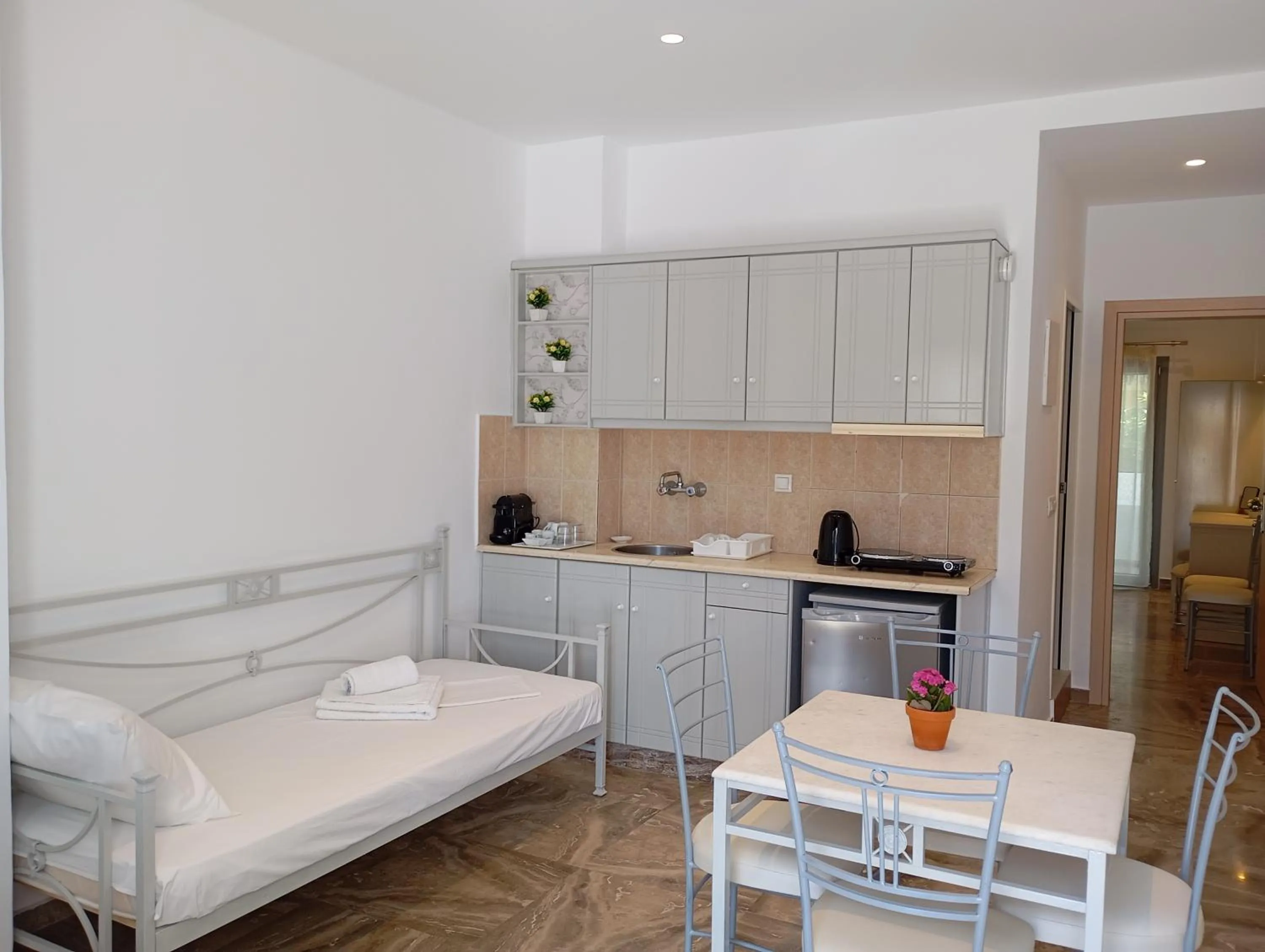 Kitchen or kitchenette, Bed in Ifestia Hotel