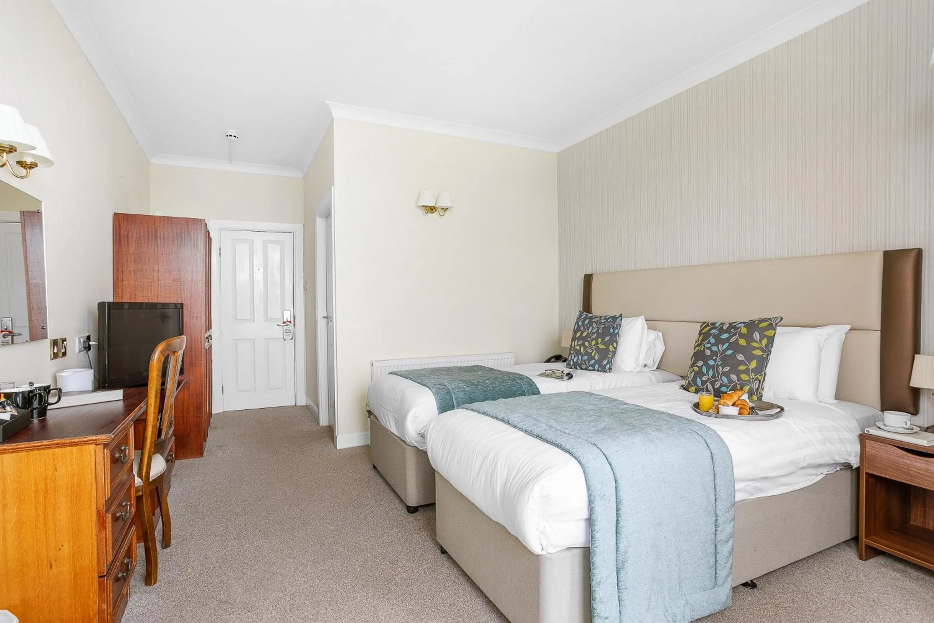 Bedroom in Royal Beacon Hotel