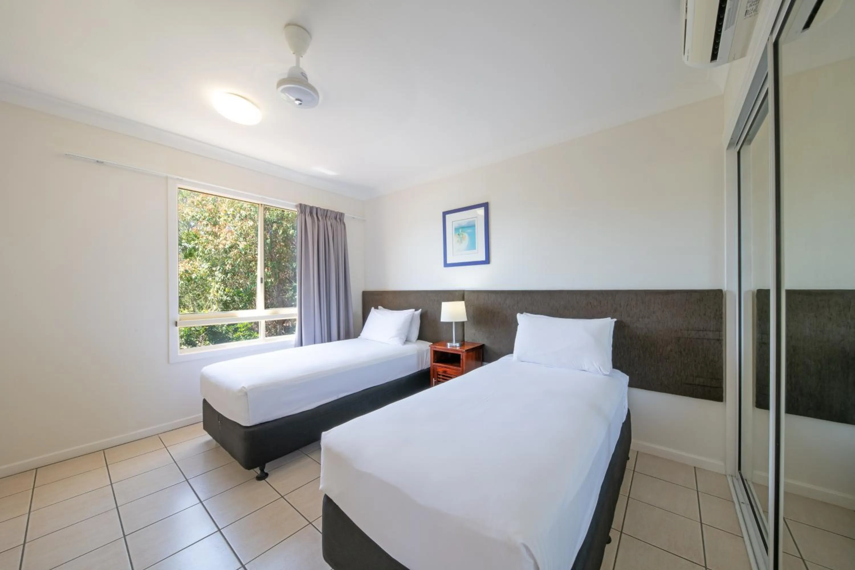 Bed in Martinique Whitsunday Resort