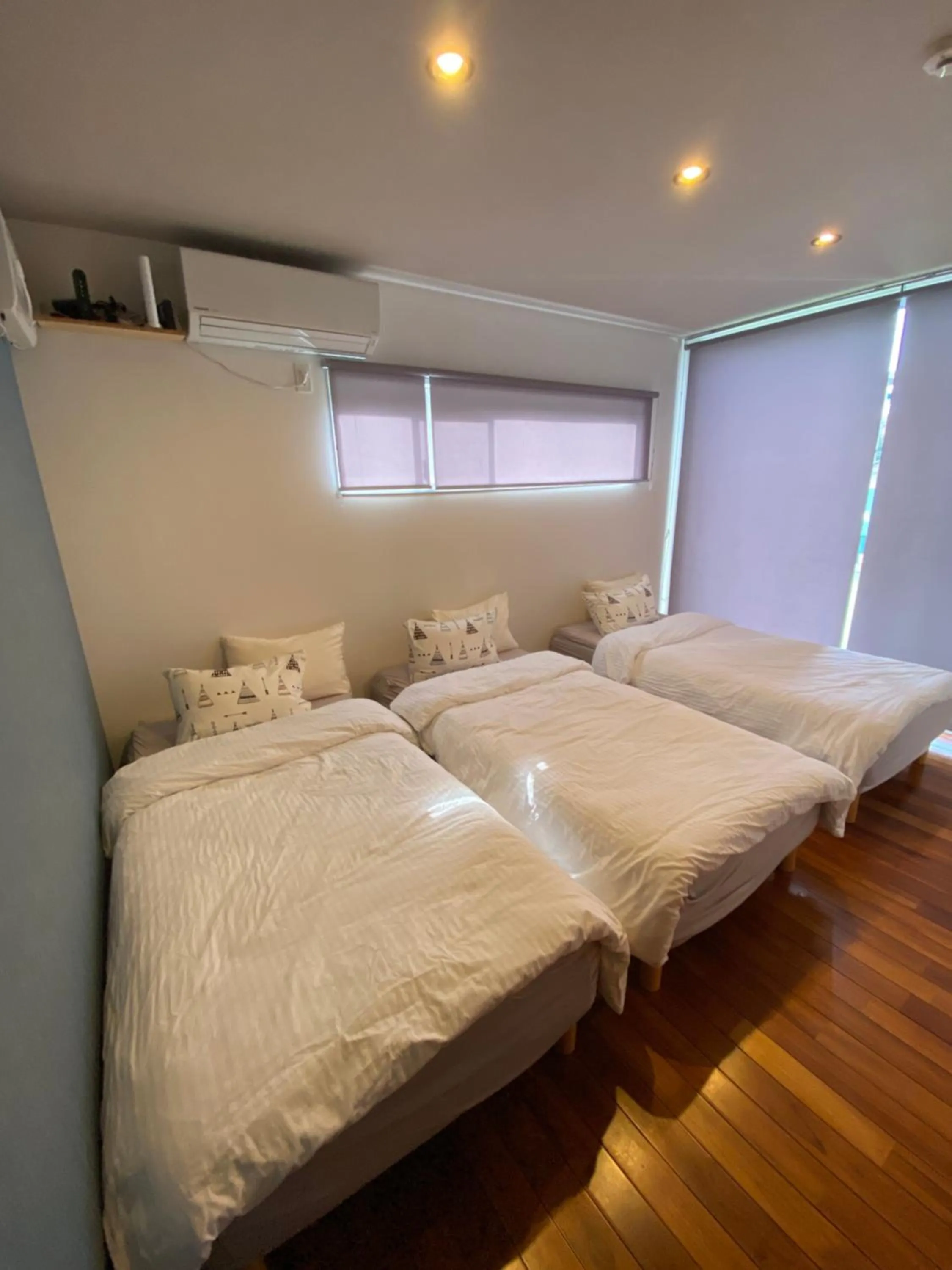 Bed in Hotel YANBARUNIA Nago