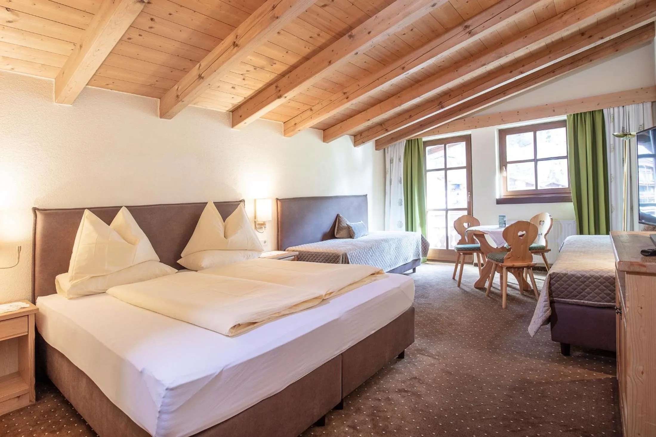 Seating area, Bed in Hotel Hubertus