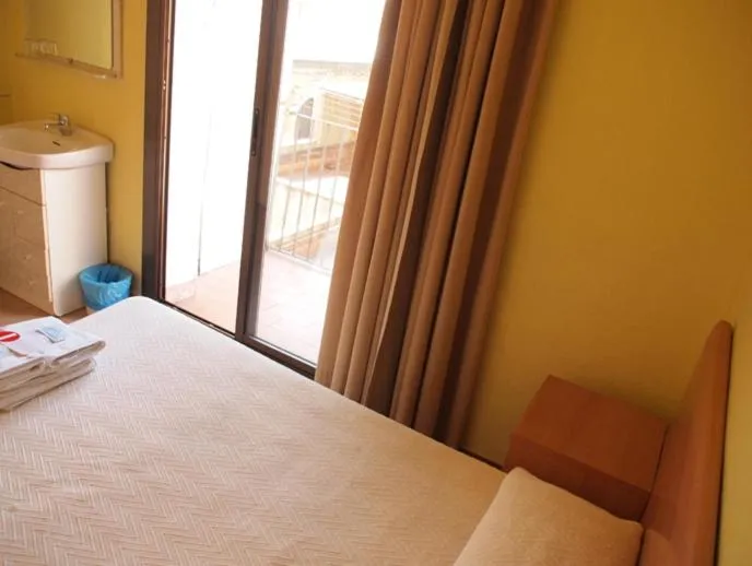 Photo of the whole room, Bed in Hostal Delfos