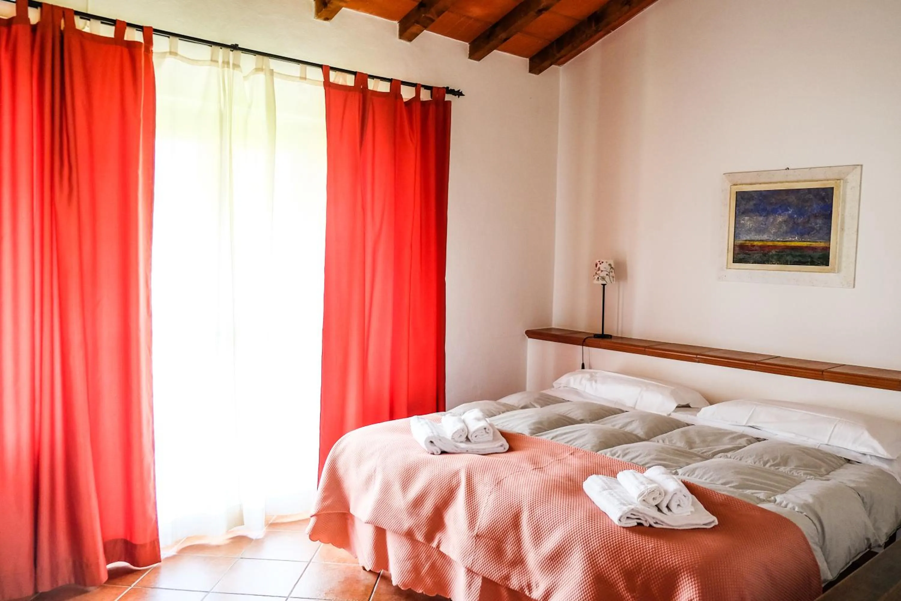Bedroom, Bed in Agriturismo biologico Bulichella