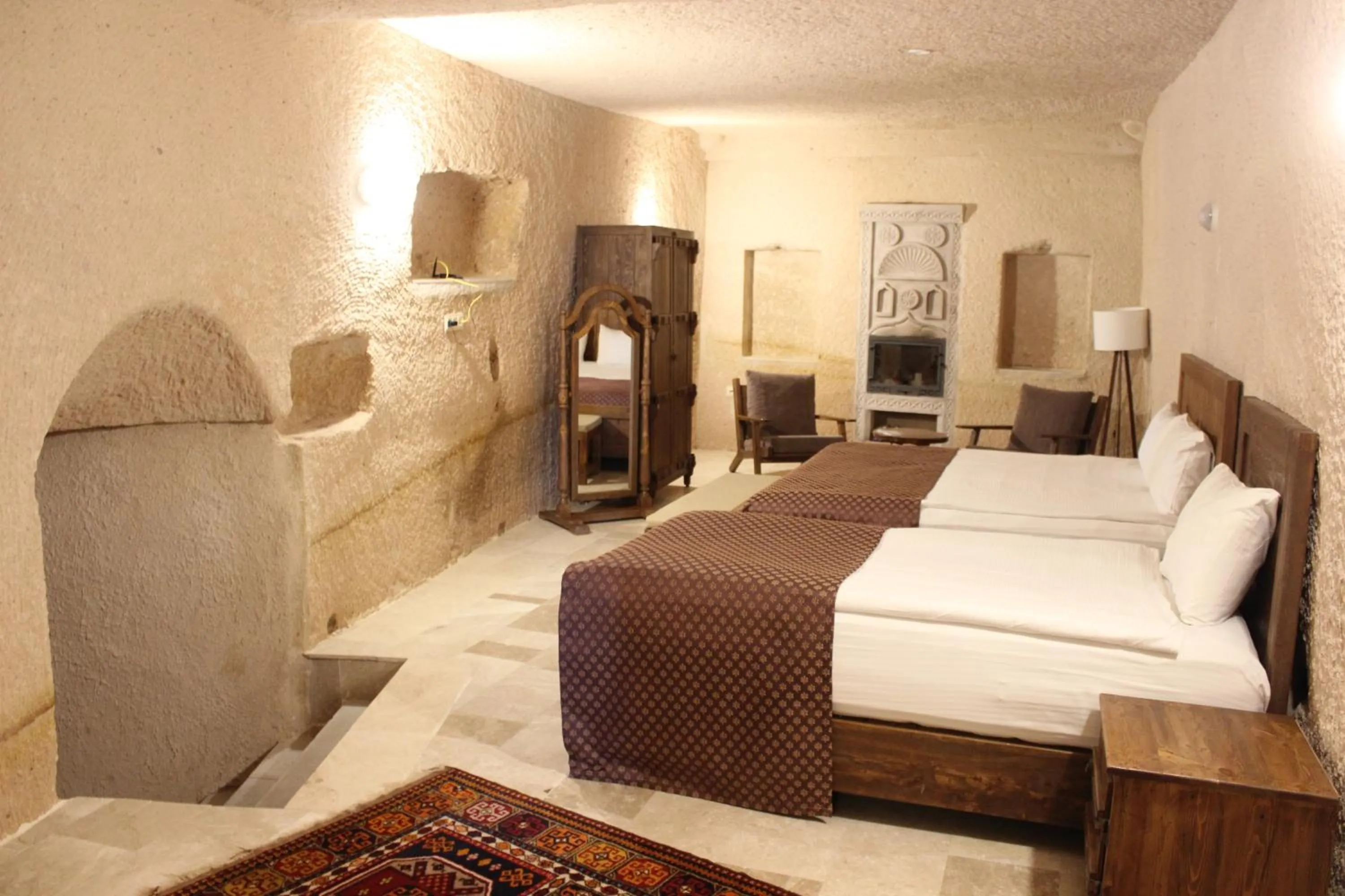 Bed in Helike Cave Suites