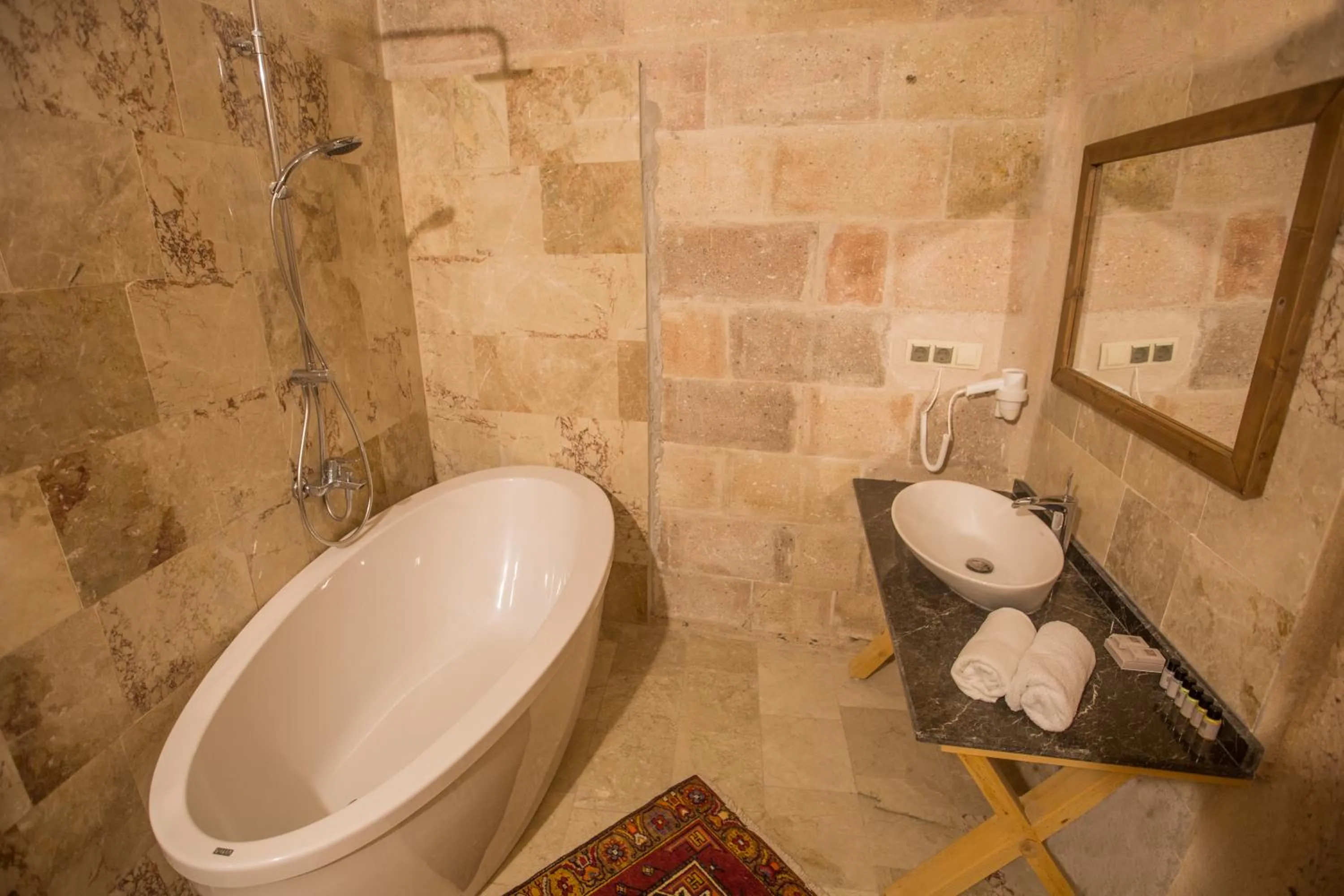 Hot Tub in Helike Cave Suites