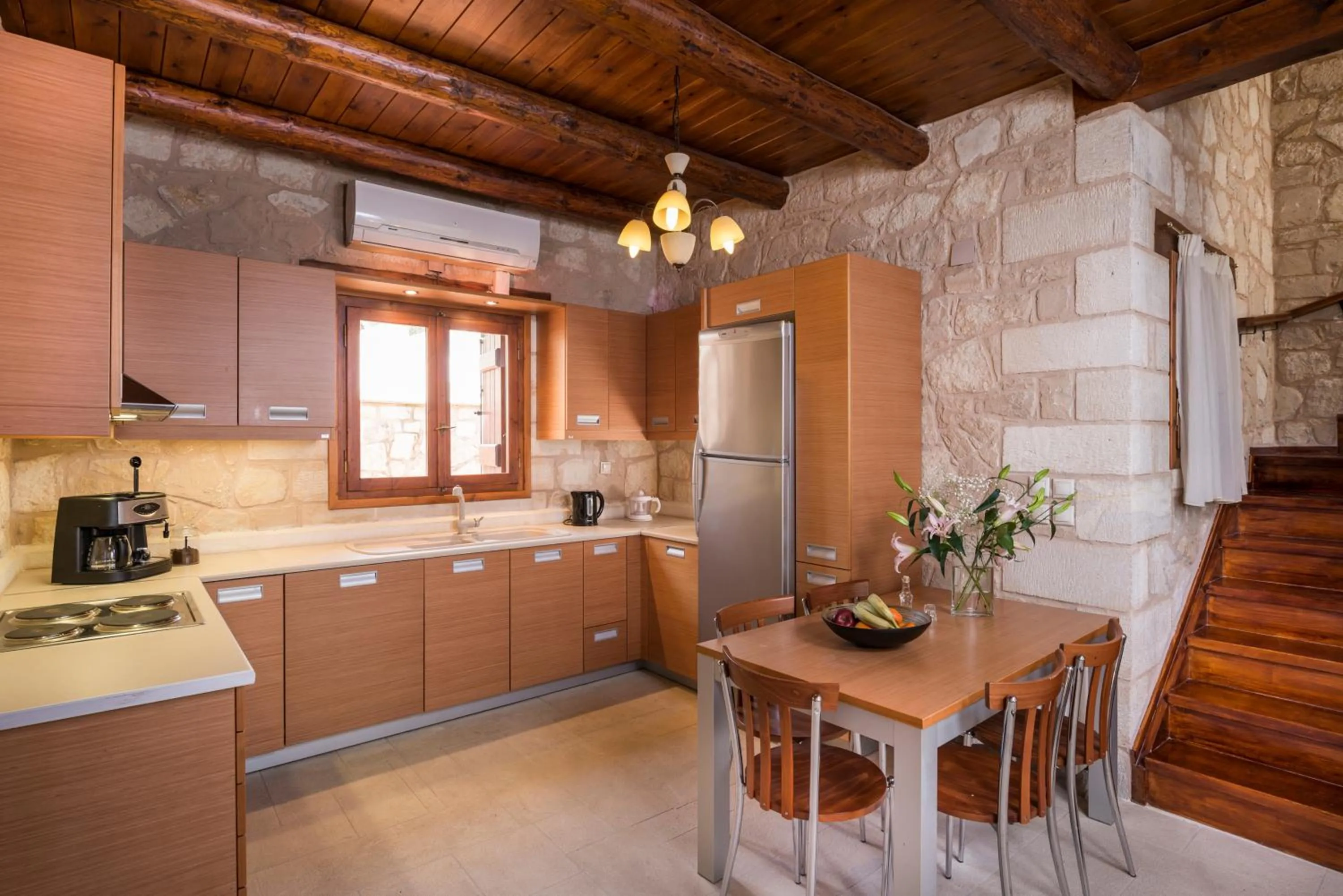 Kitchen or kitchenette in Spilia Village Hotel & Villas