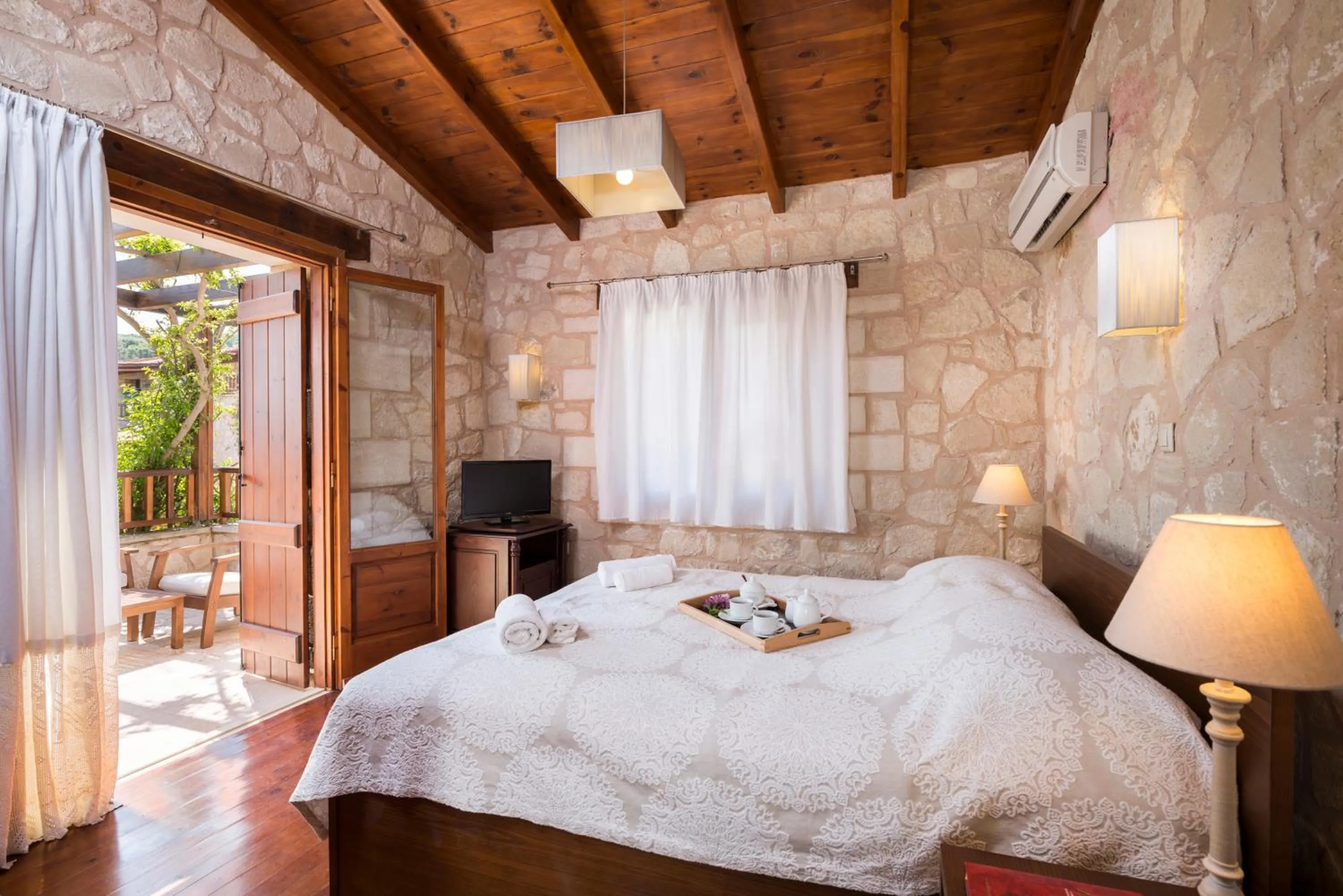 Bed in Spilia Village Hotel & Villas