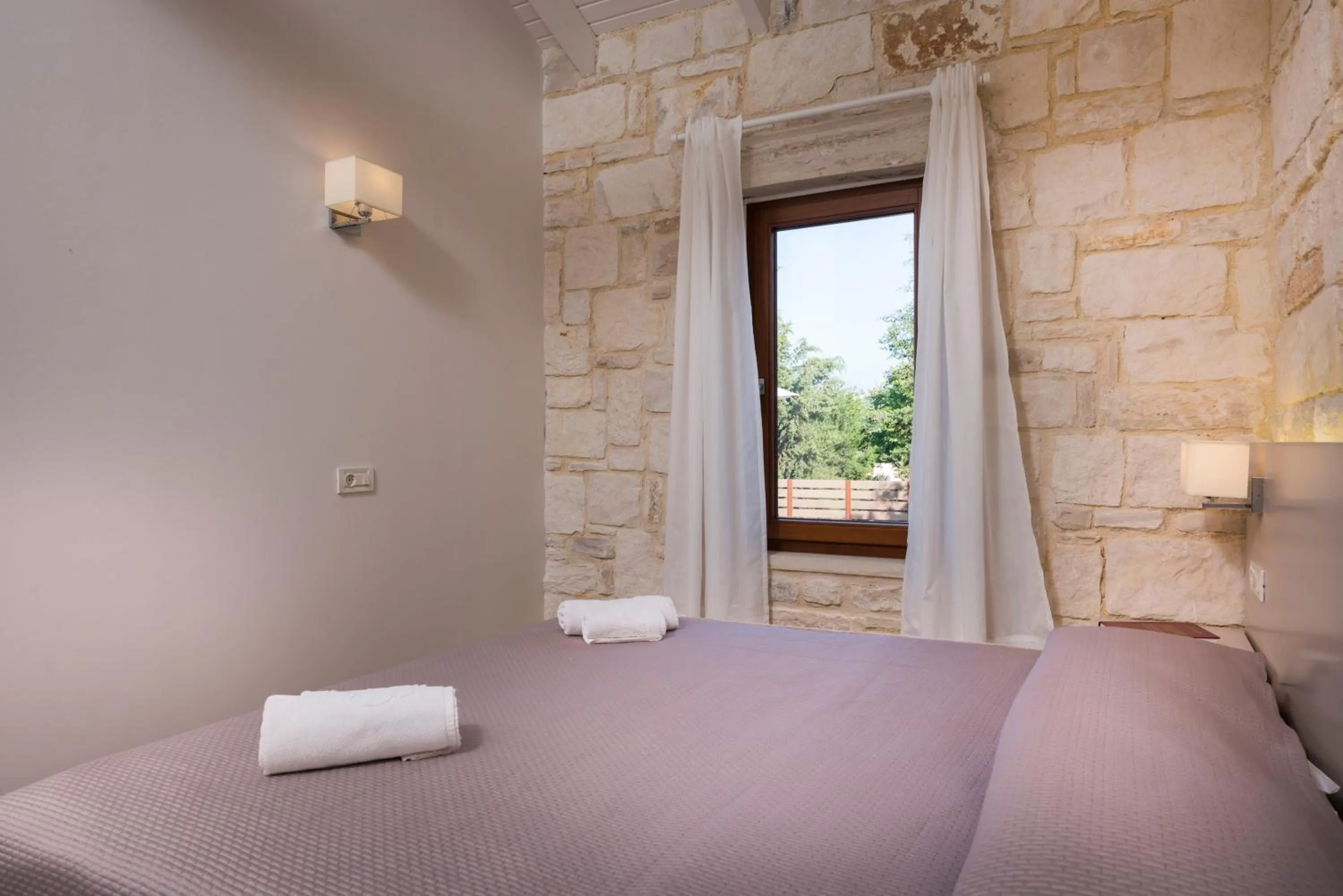 Bed in Spilia Village Hotel & Villas