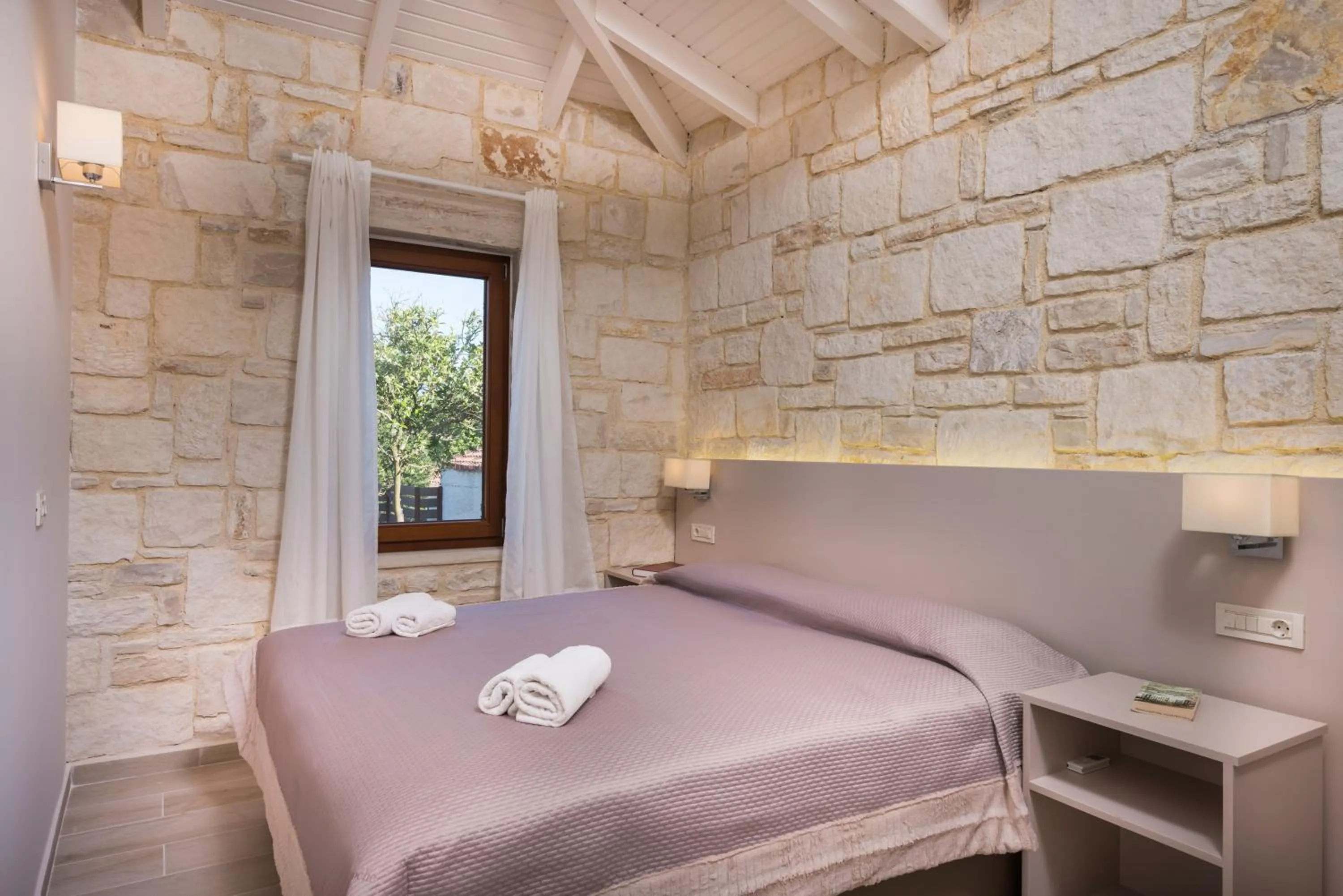 Bed in Spilia Village Hotel & Villas