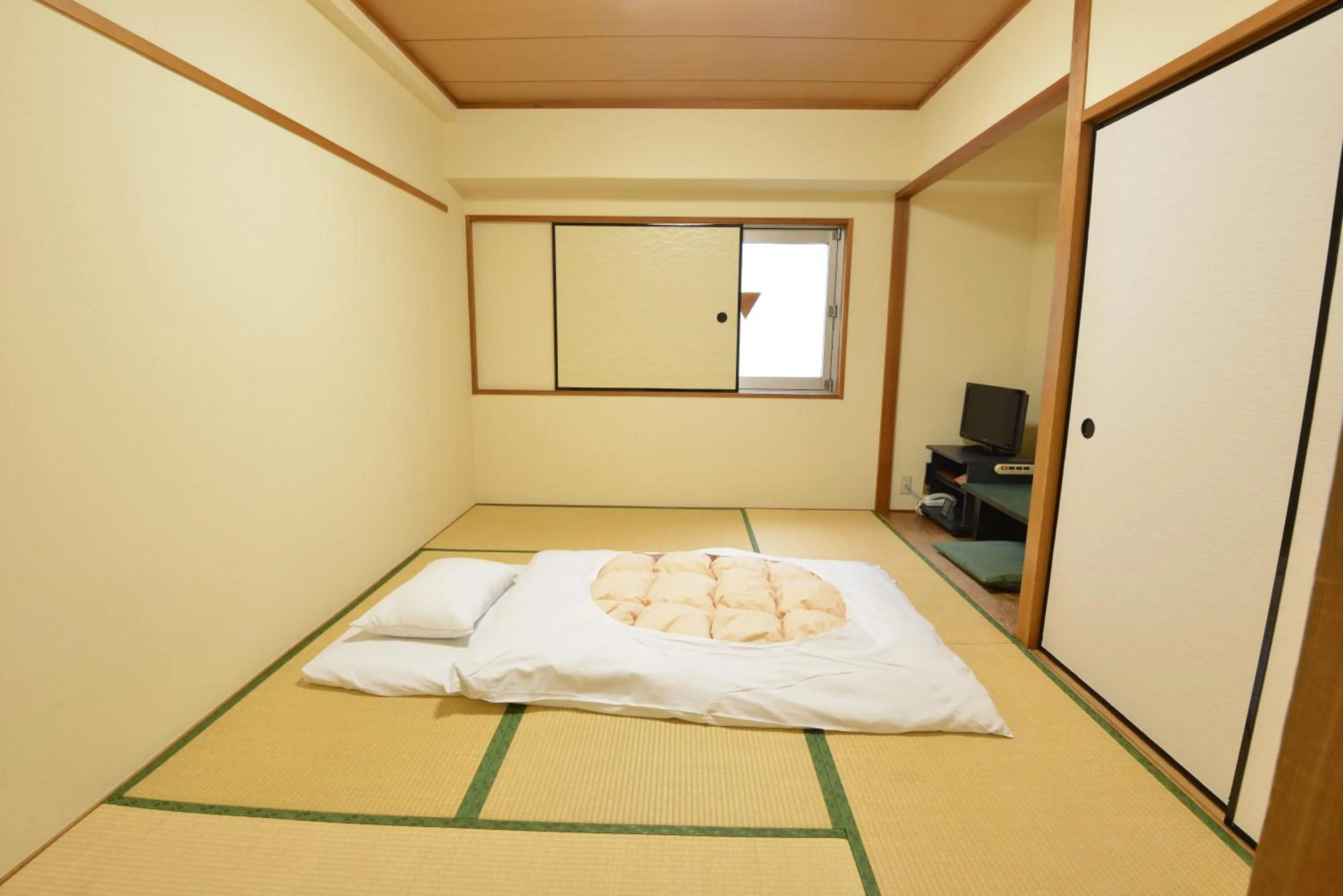 Bed in Hotel Marutani