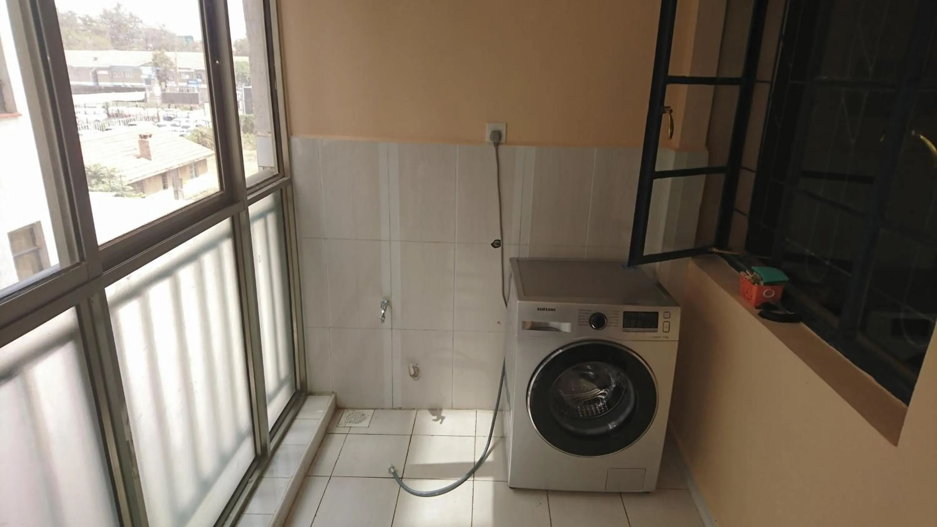 washing machine in Covitech Apartments