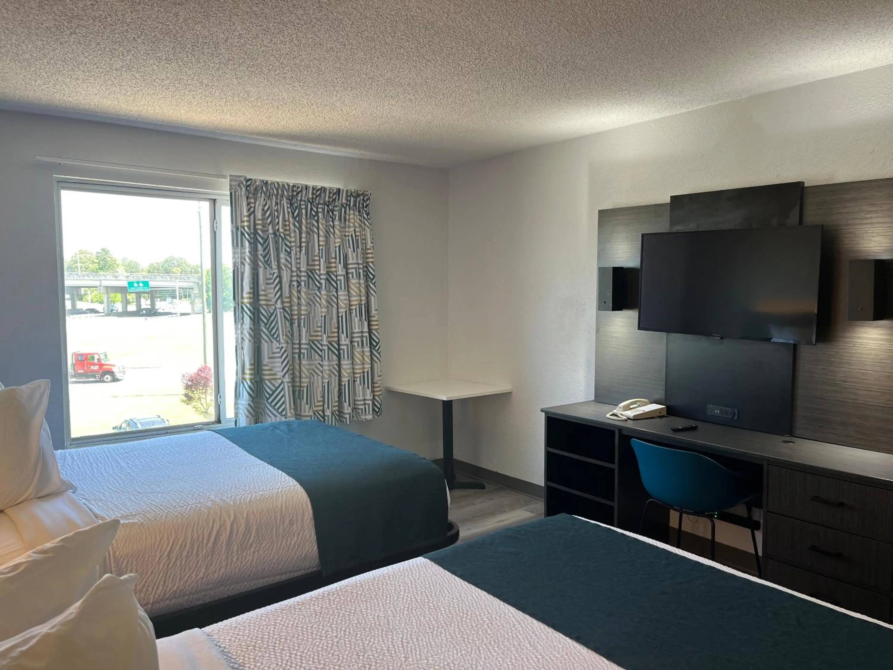 Bed in Studio 6 Suites Norcross, GA