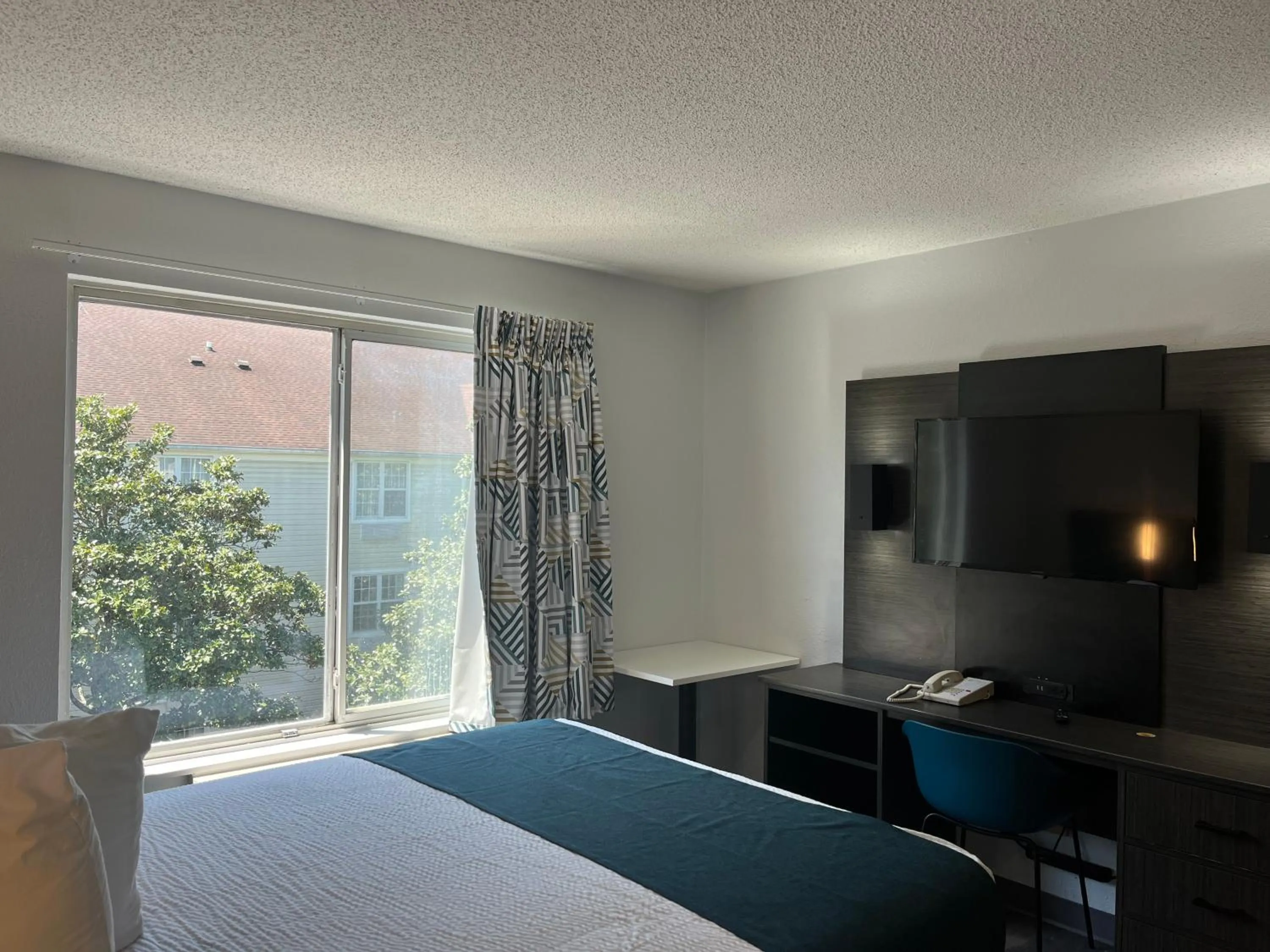 Bed in Studio 6 Suites Norcross, GA