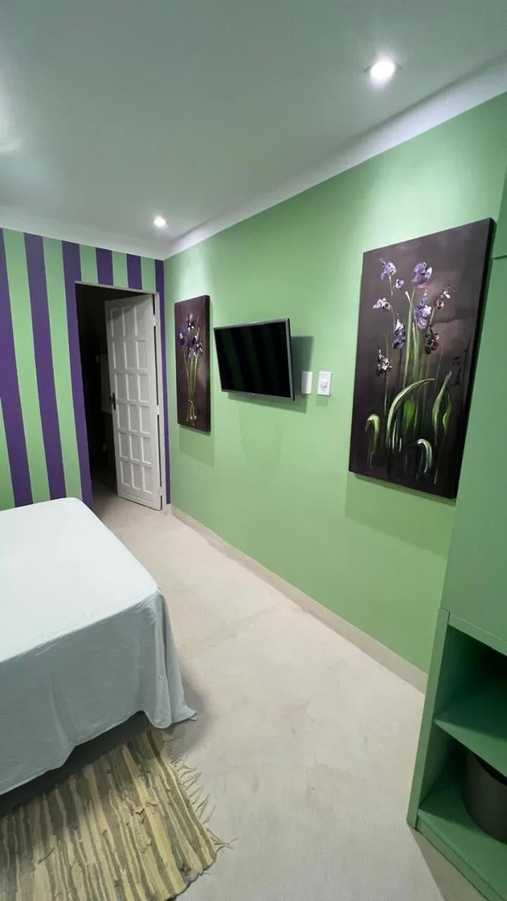 Bed in Pousada Via Brasil